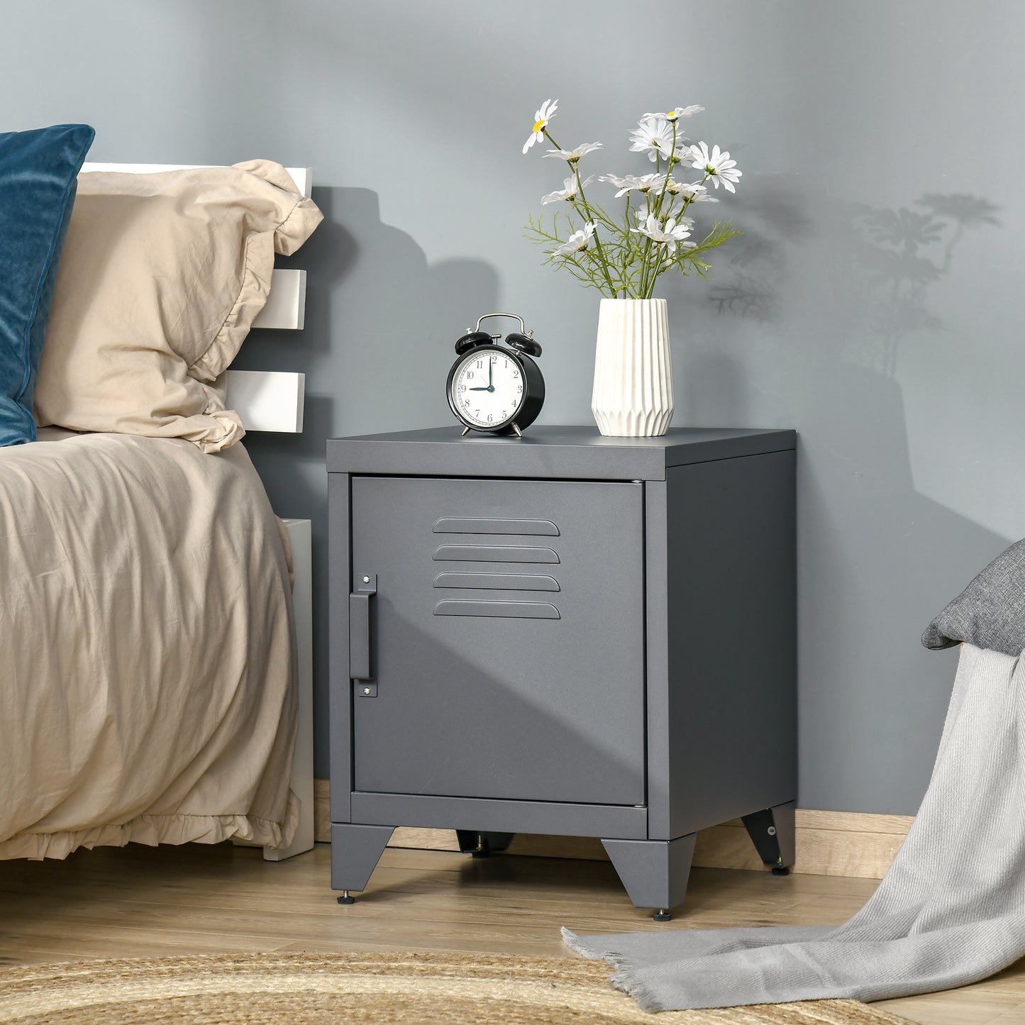 Gray metal bedside locker with louvered door and adjustable feet