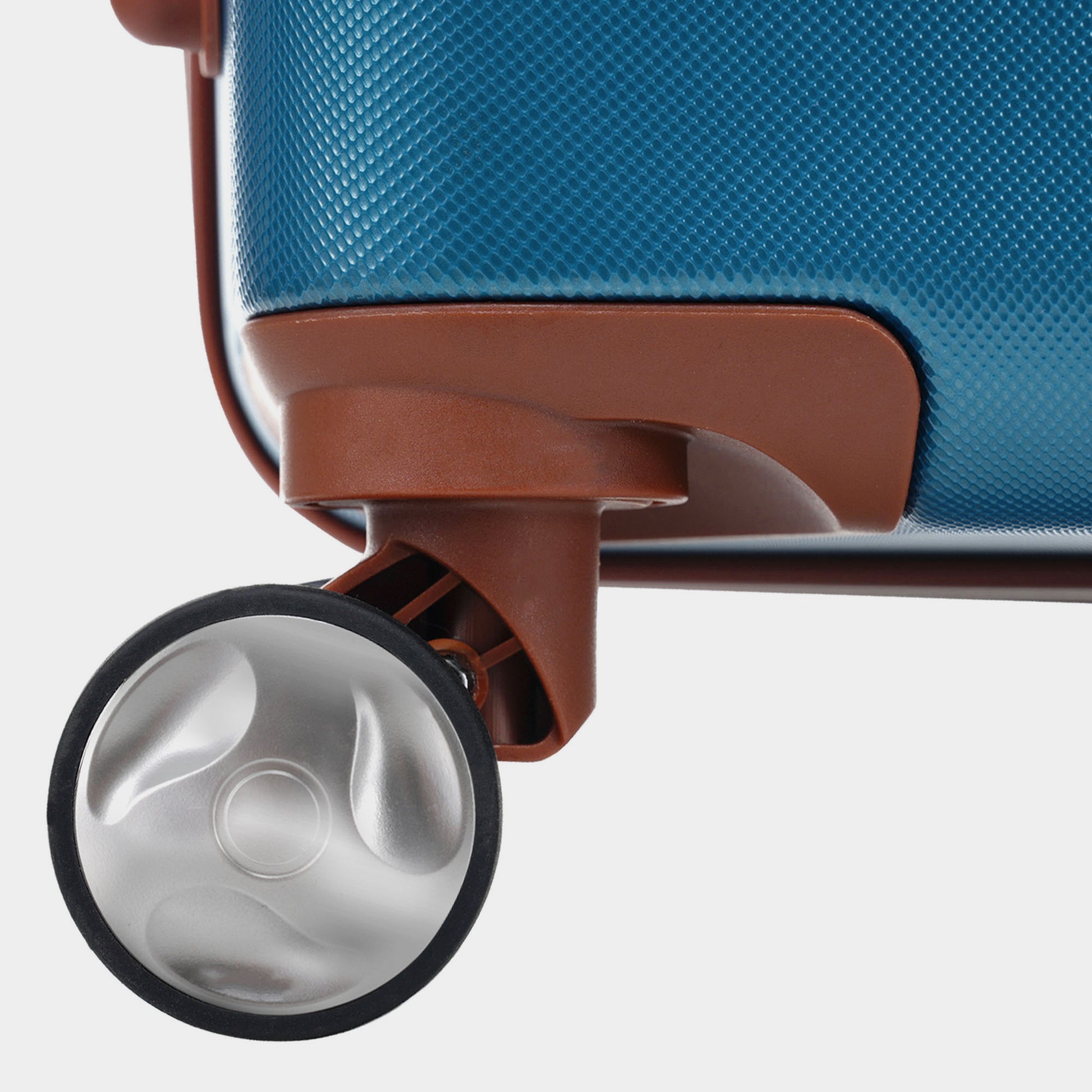 Textured teal suitcase with brown wheel housing and silver spinner wheel