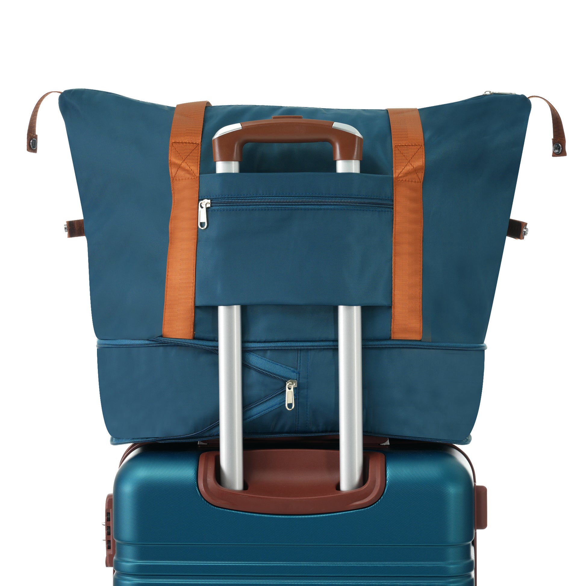 Teal duffel bag with tan straps on a teal rolling suitcase perfect for travel