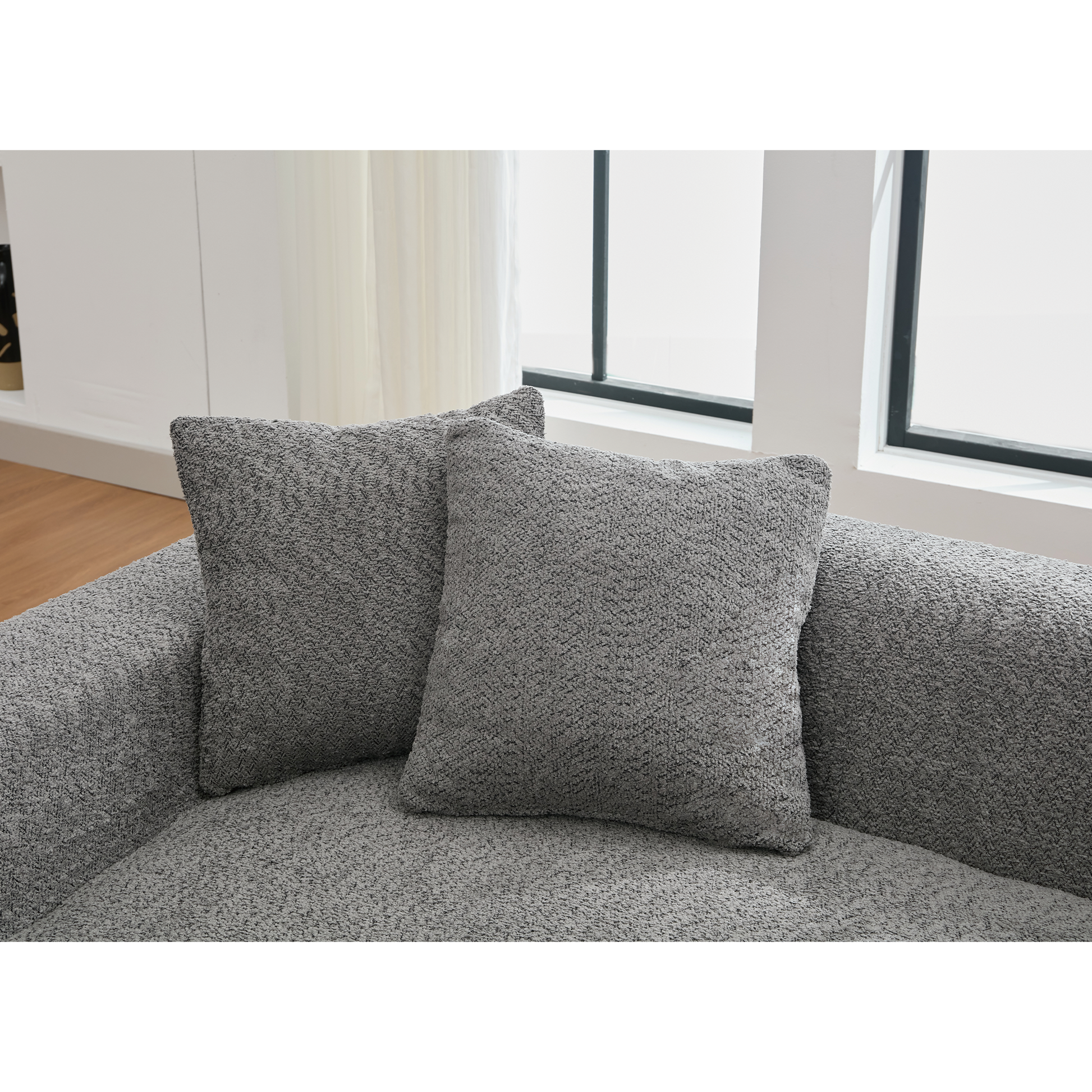 Two textured gray accent pillows on a matching sofa adding comfort to living spaces