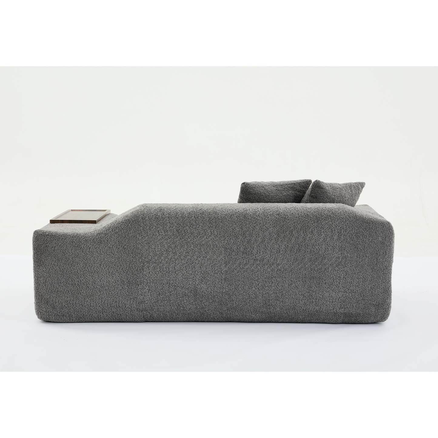 Modern grey boucle sofa with integrated wooden tray and plush cushions