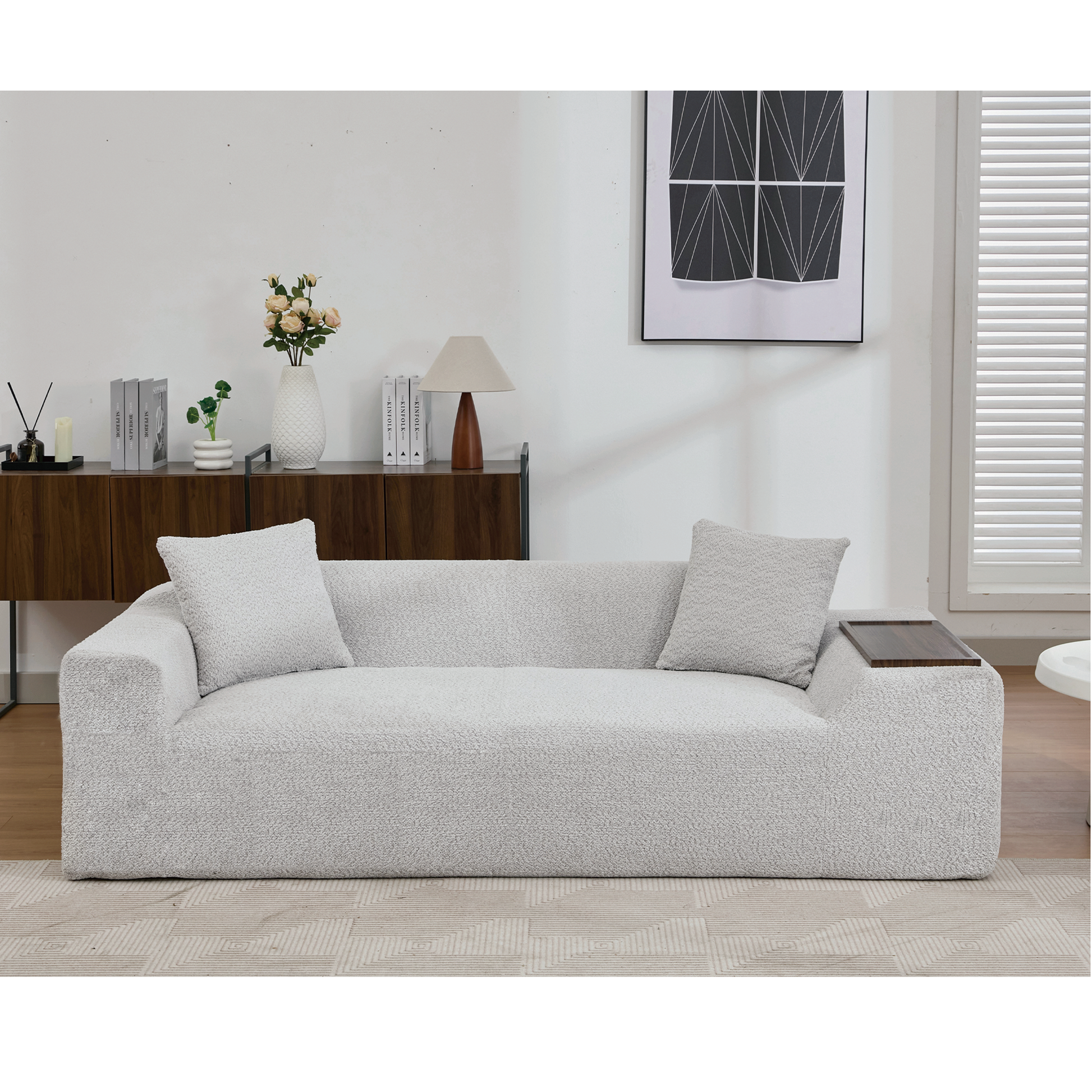 Modern boucle fabric sofa in light grey featuring plush cushions and a chic armchair design for living room comfort