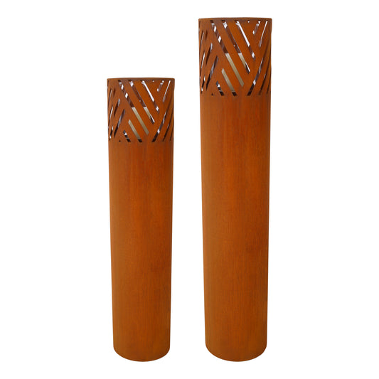 Two rustic corten steel garden lanterns with cutout geometric patterns