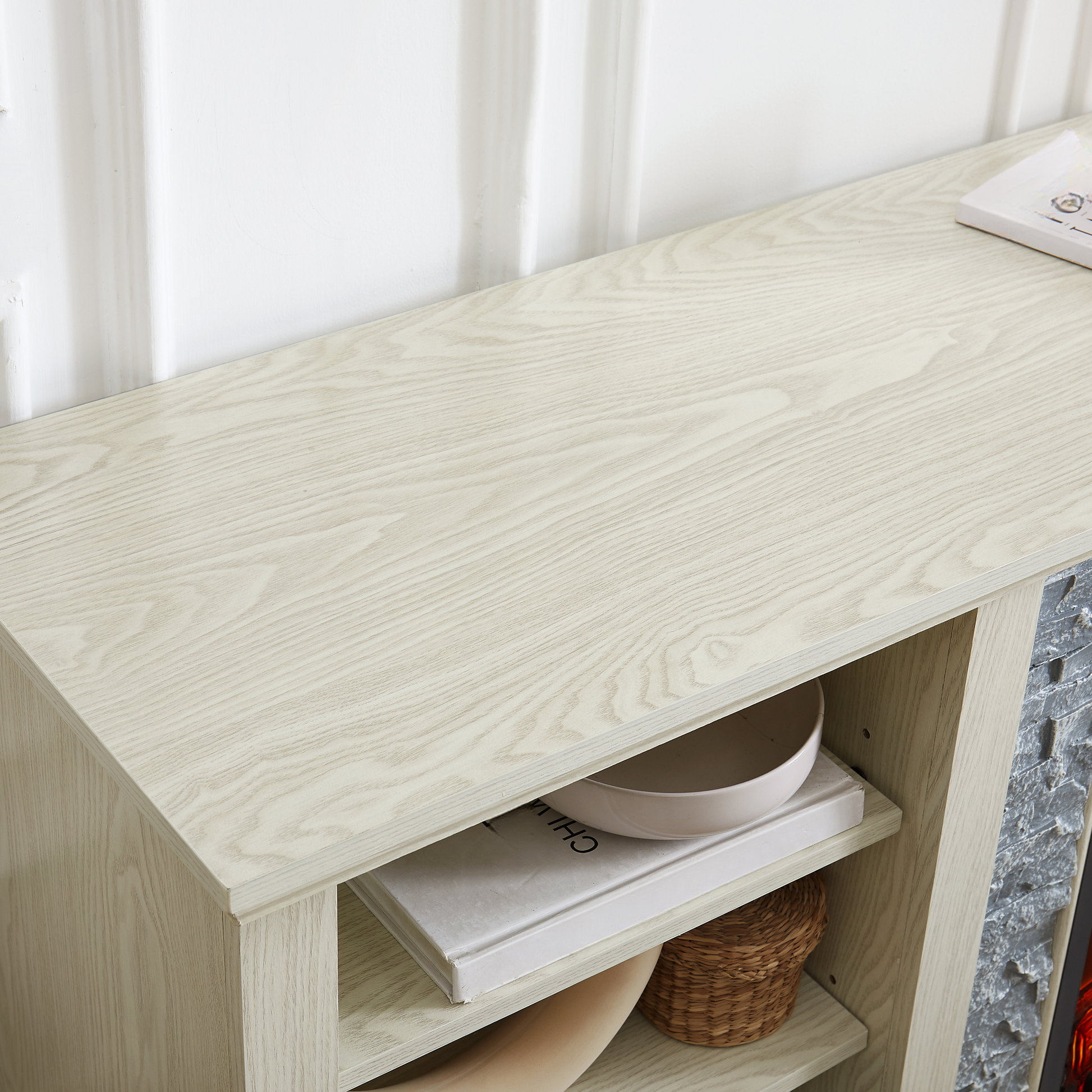 Light oak wood entertainment center shelf with decorative items