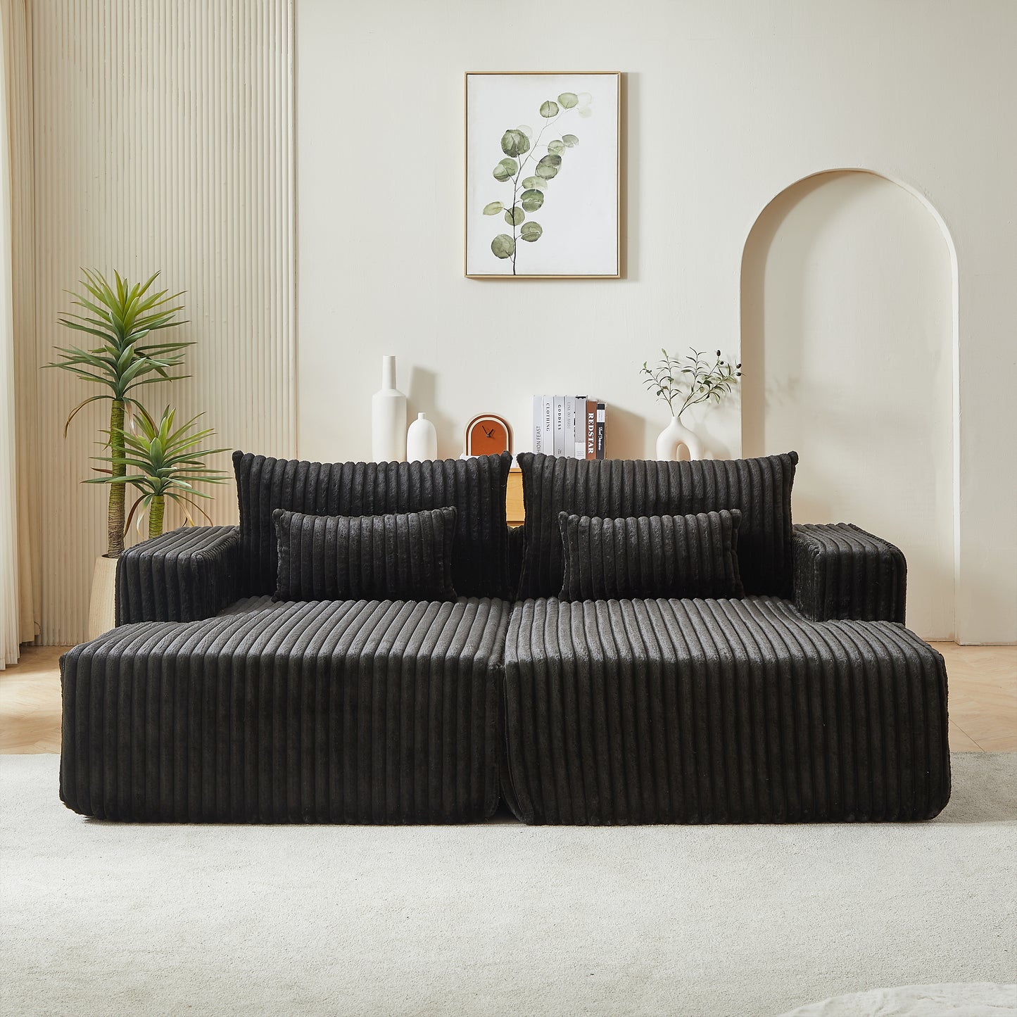 Plush dark gray corduroy sectional sofa with matching throw pillows for a modern living room