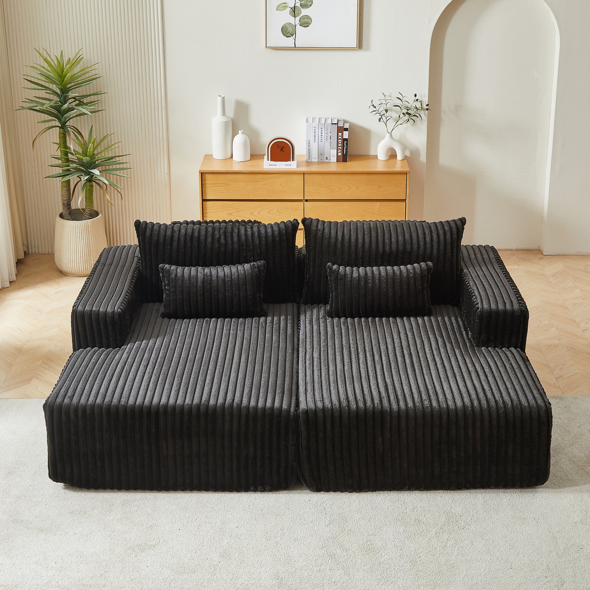 Plush corduroy sectional sofa in charcoal grey with plush throw pillows perfect for modern living rooms