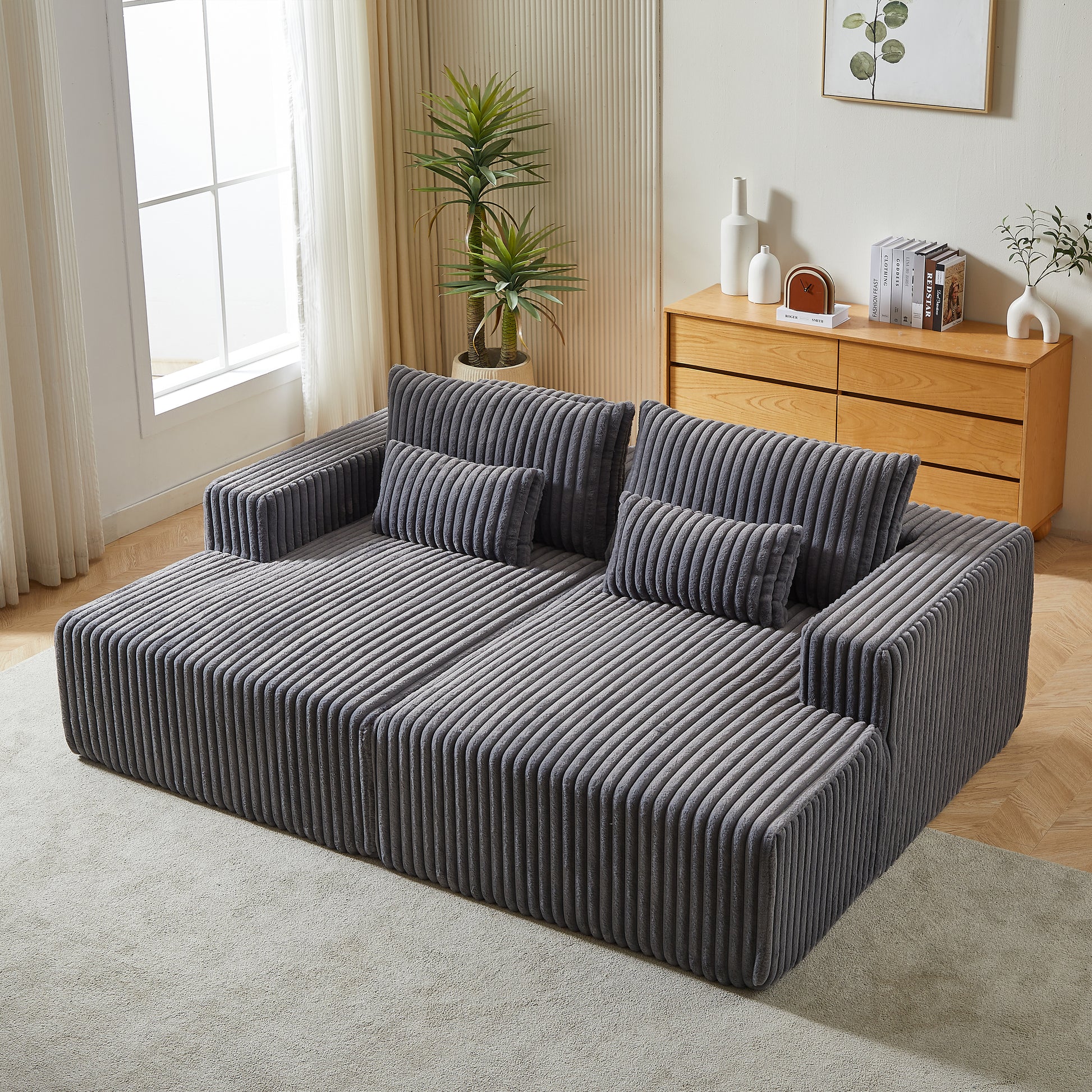 Dark gray corduroy sectional sofa with plush cushions and modern design perfect for living rooms