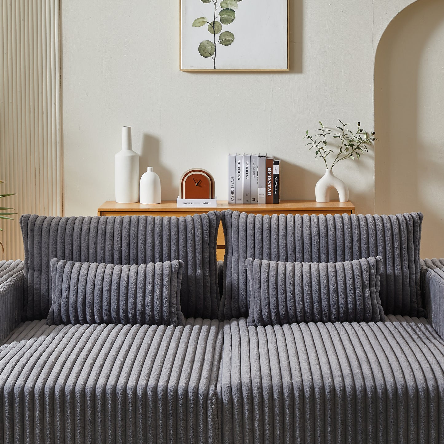 Plush grey corduroy sofa with two lumbar throw pillows perfect for modern living rooms