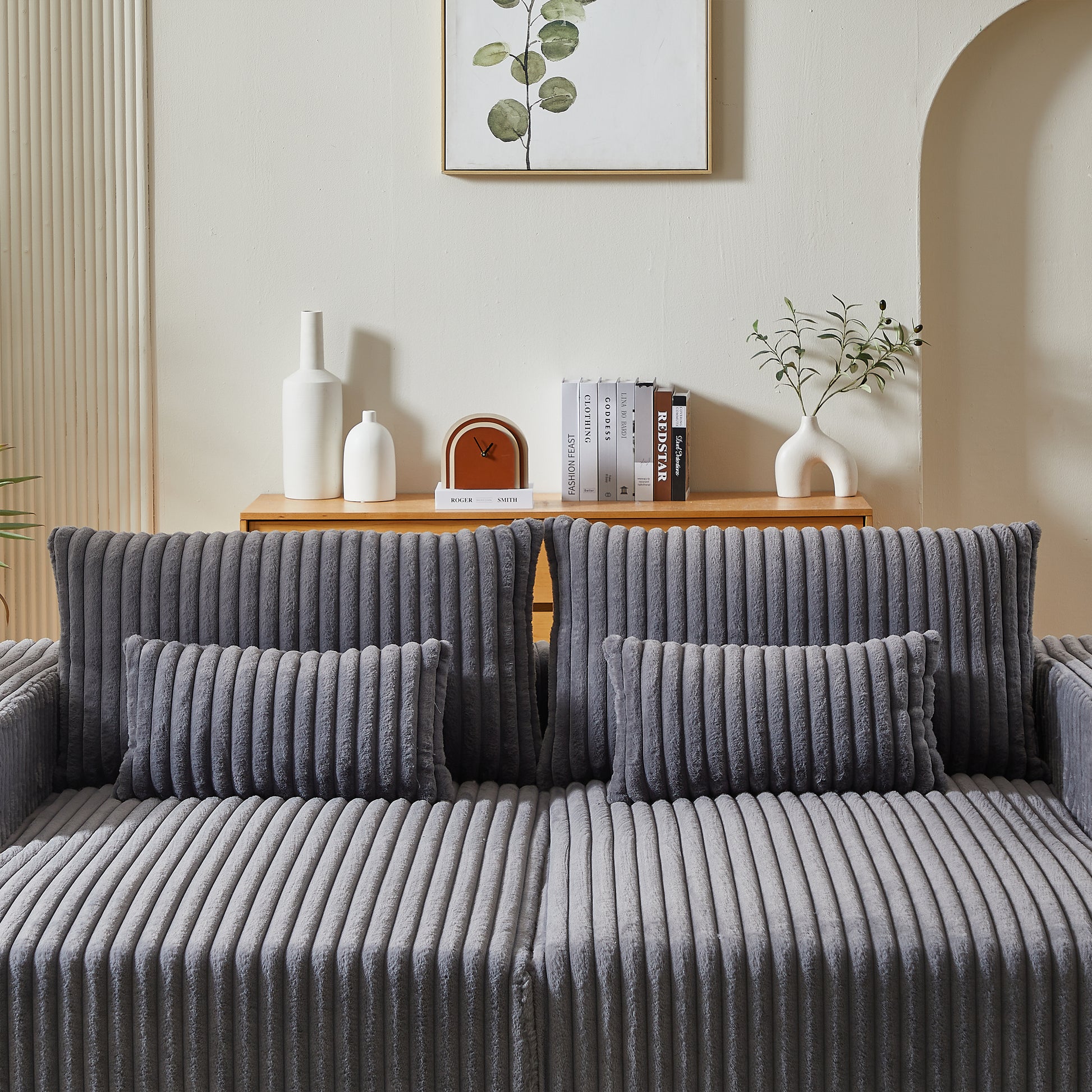 Plush grey corduroy sofa with two lumbar throw pillows perfect for modern living rooms