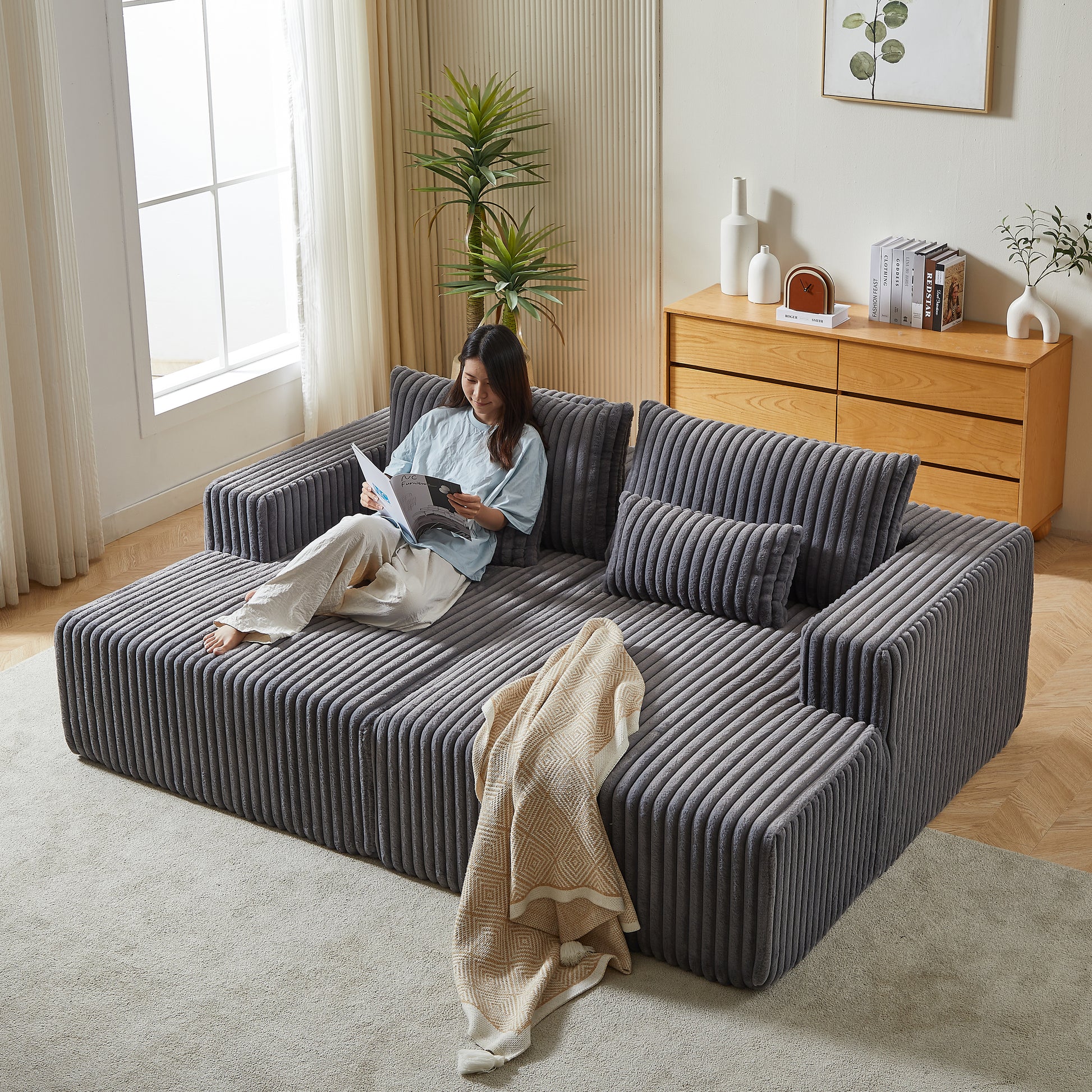 Comfortable gray corduroy sectional sofa with plush cushions ideal for modern living rooms