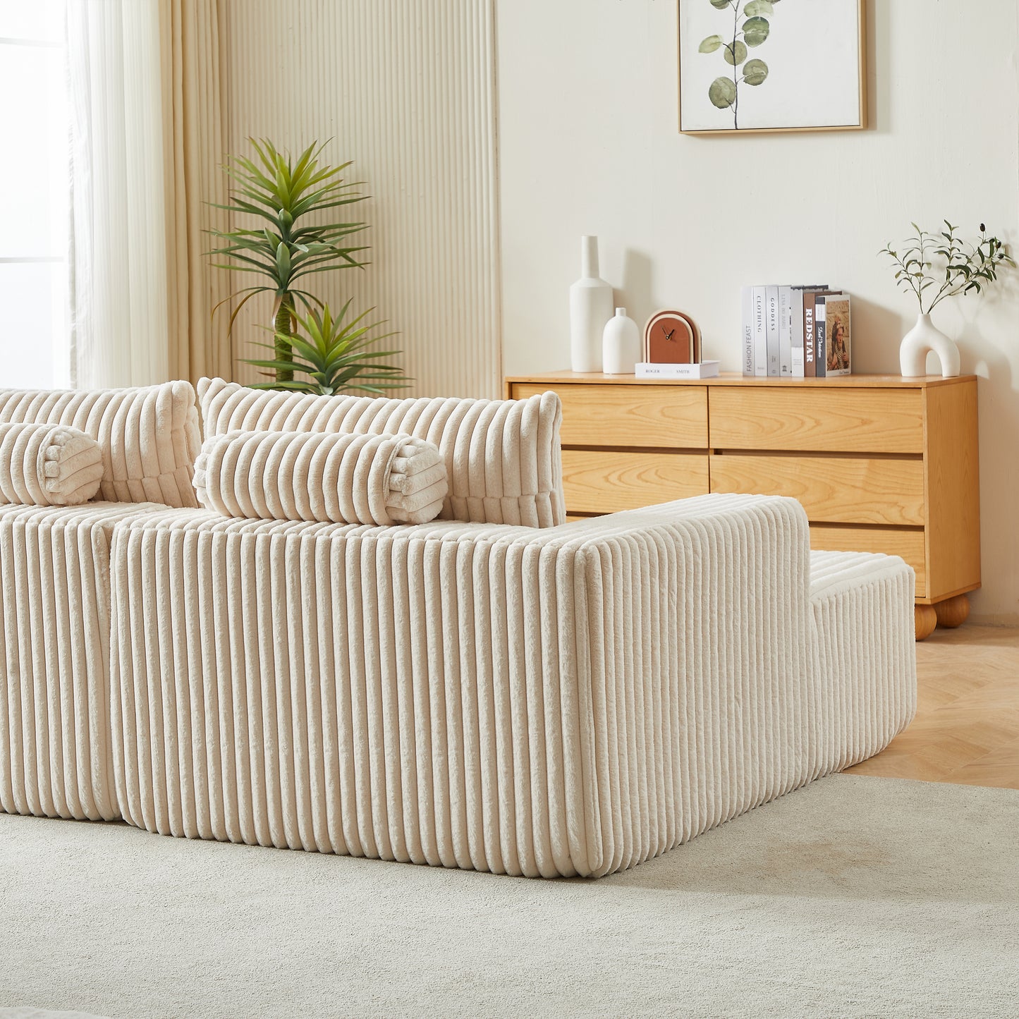 Cream corduroy modular sofa with plush cushions and a comfortable seating arrangement