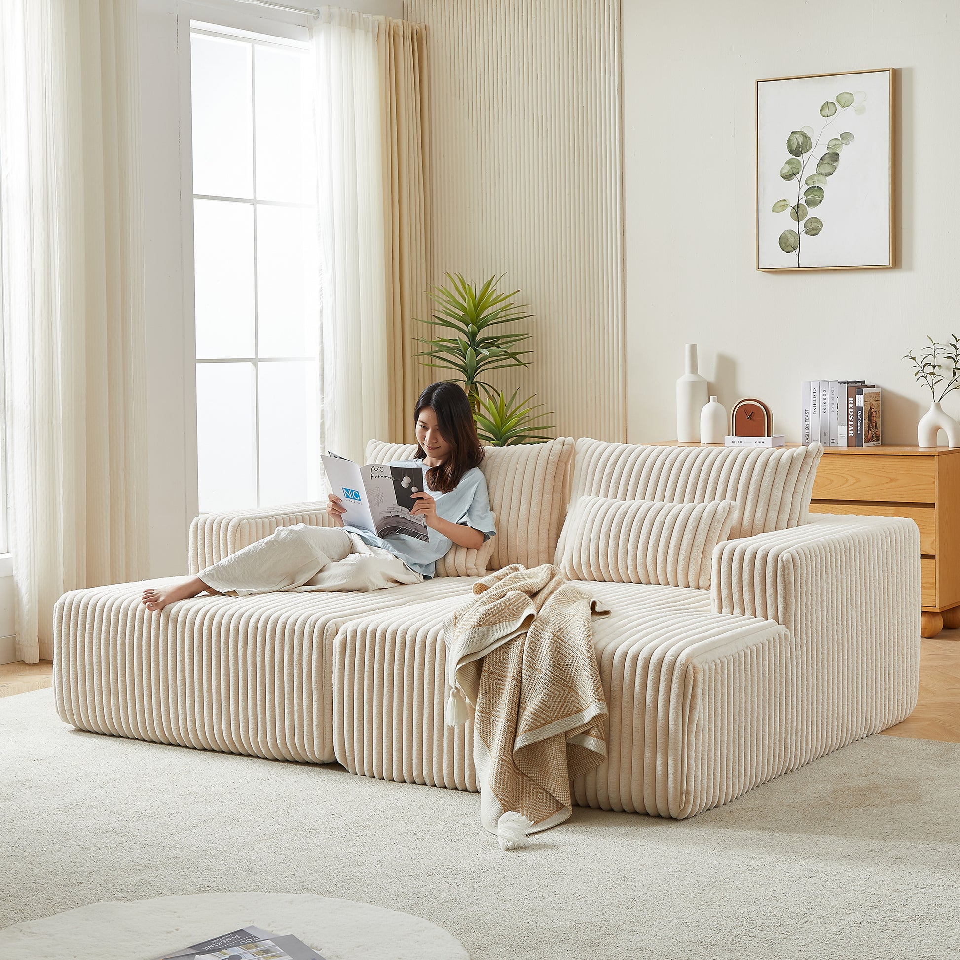 Cream corduroy sectional sofa with plush textured fabric and modular design