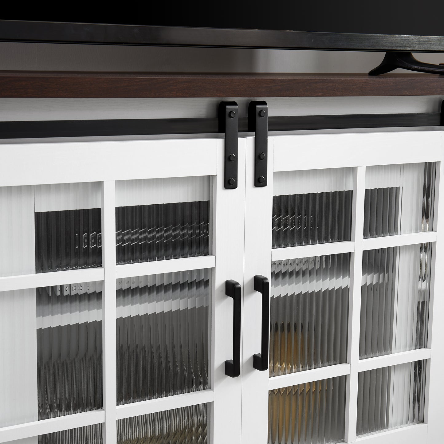 White media console with fluted glass doors and black metal hardware