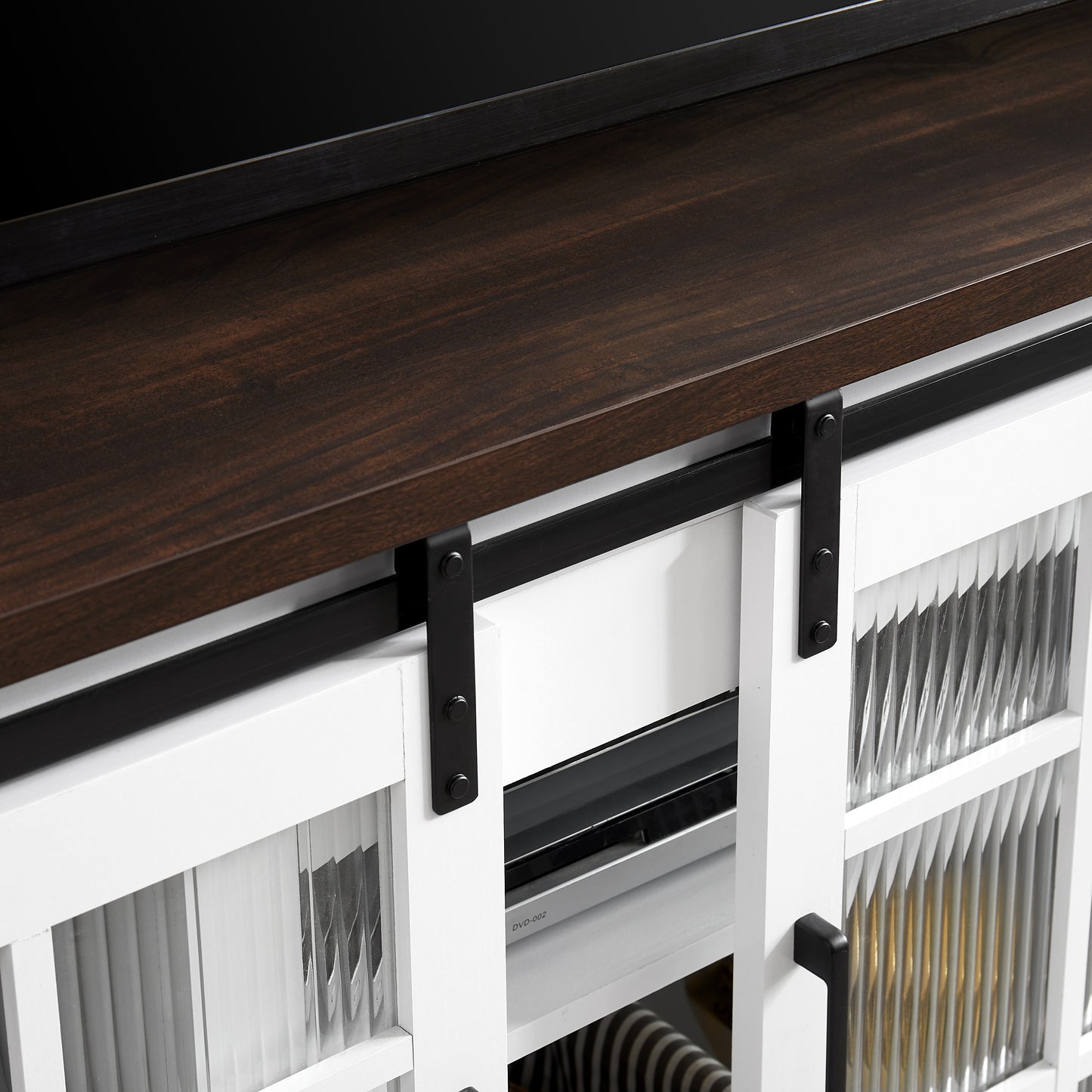 White media console with fluted glass doors and dark wood top