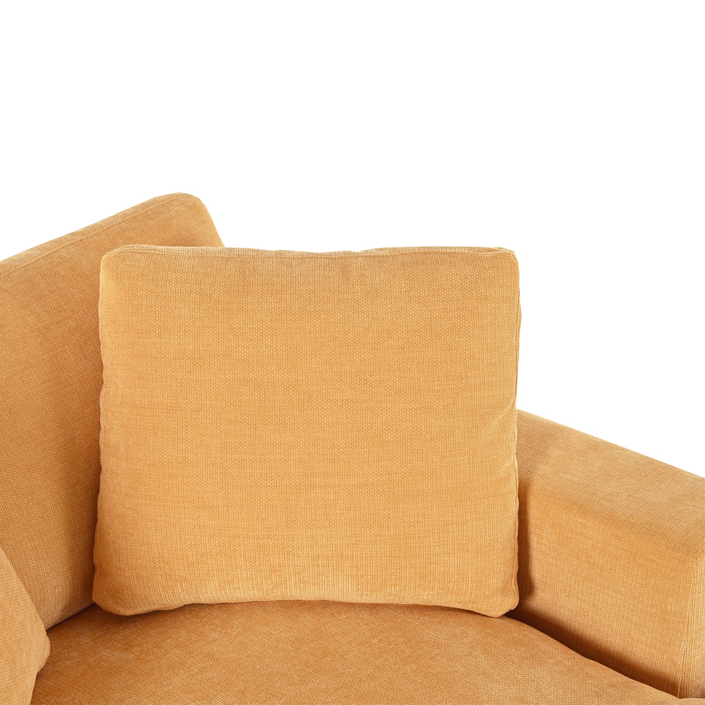 Close up of a plush orange velvet couch cushion with textured fabric
