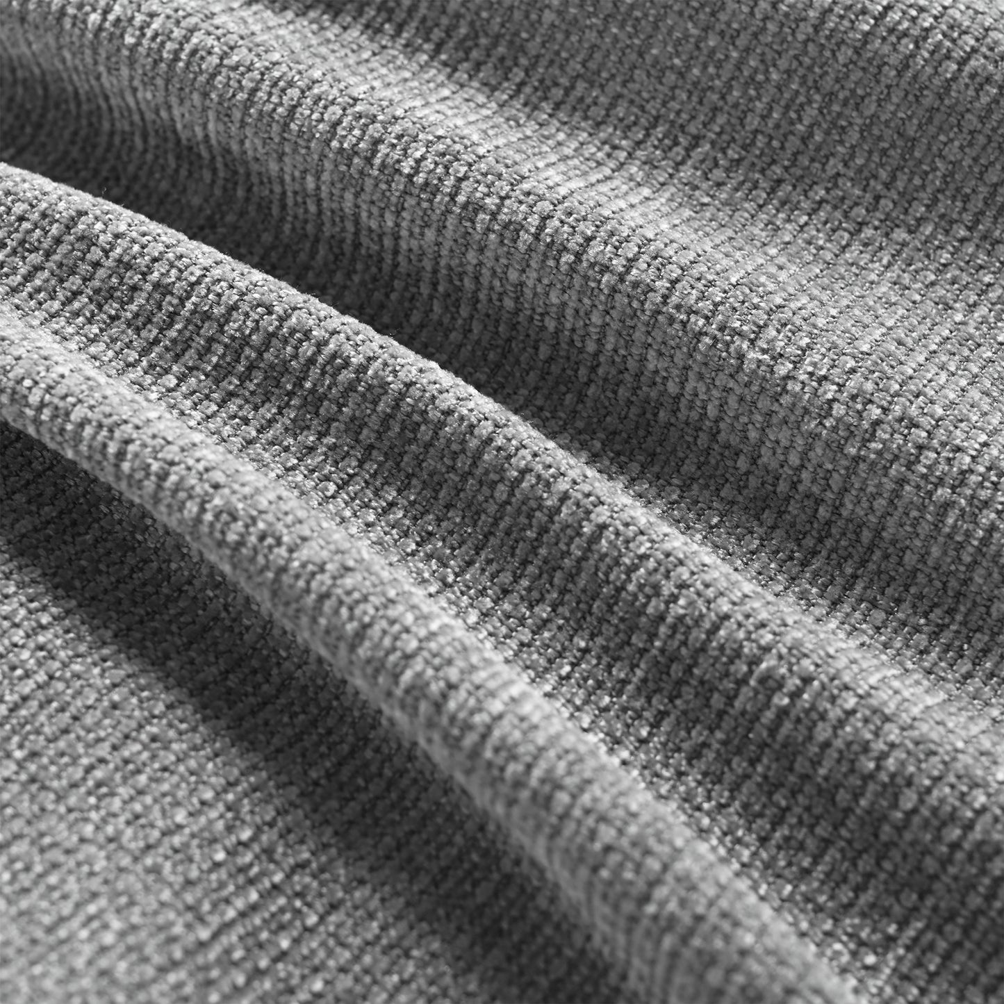 Closeup of textured grey chenille fabric with soft folds