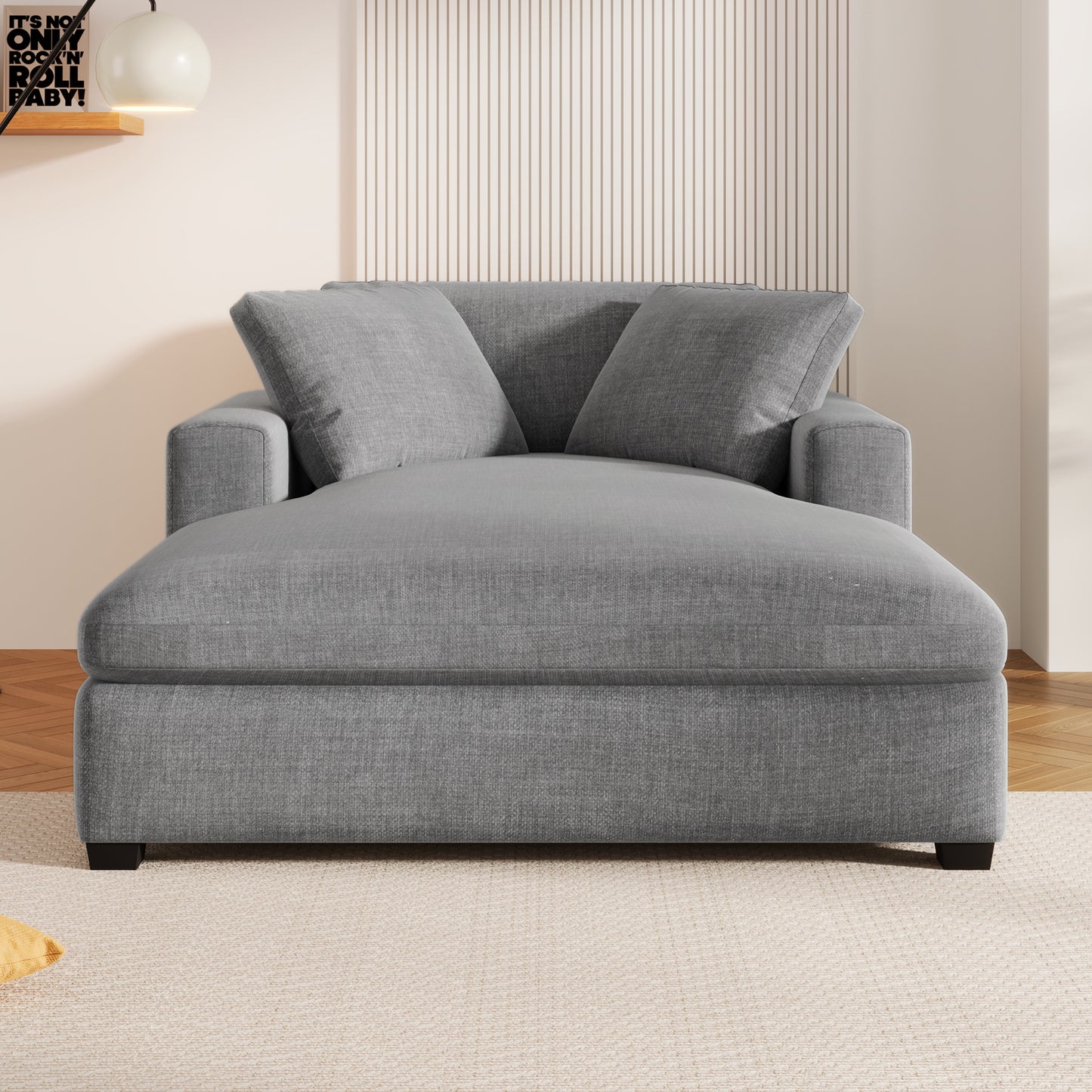Plush grey fabric chaise lounge with two plush back pillows perfect for lounging