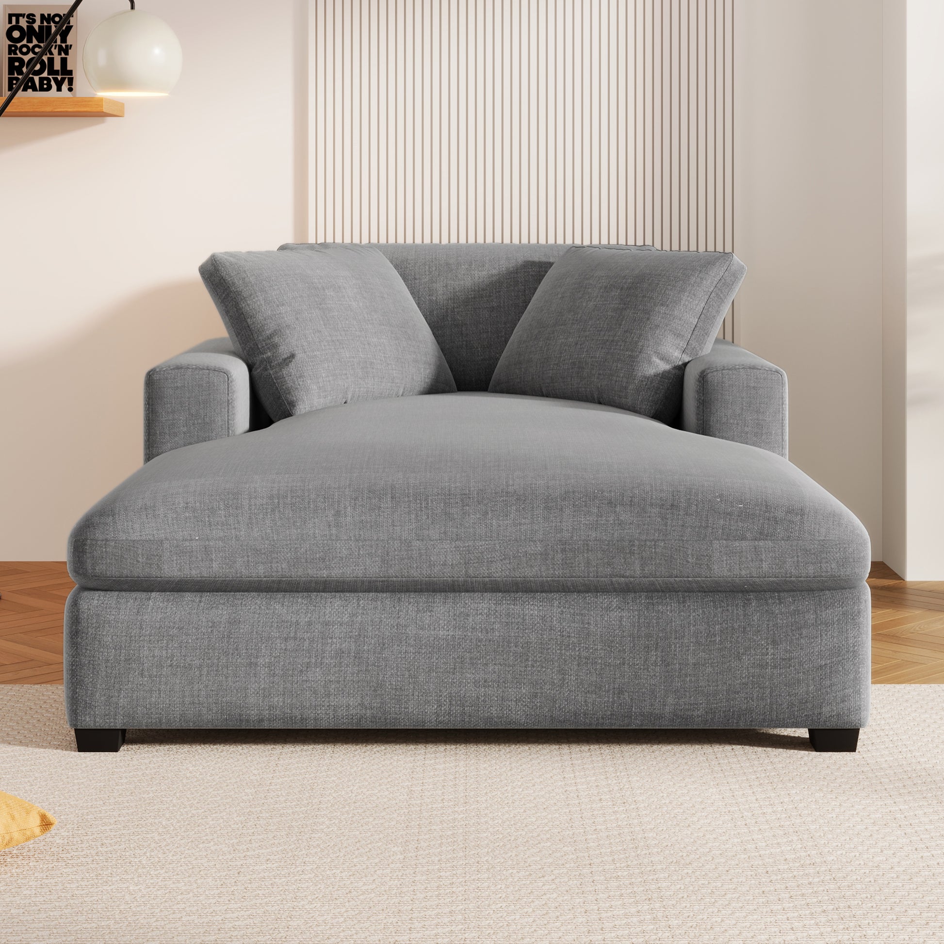 Plush grey fabric chaise lounge with two plush back pillows perfect for lounging
