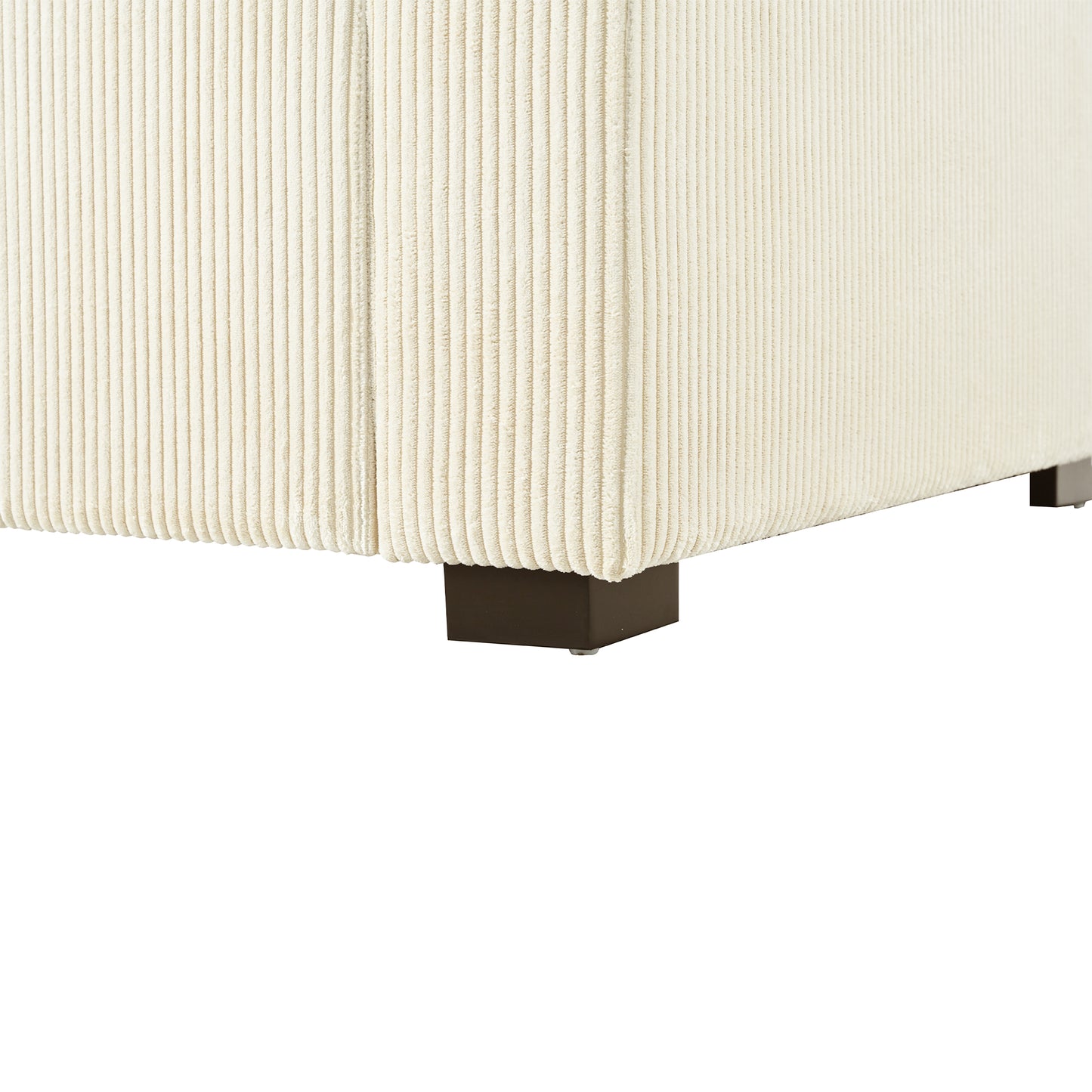 Cream corduroy ottoman corner with dark wood feet