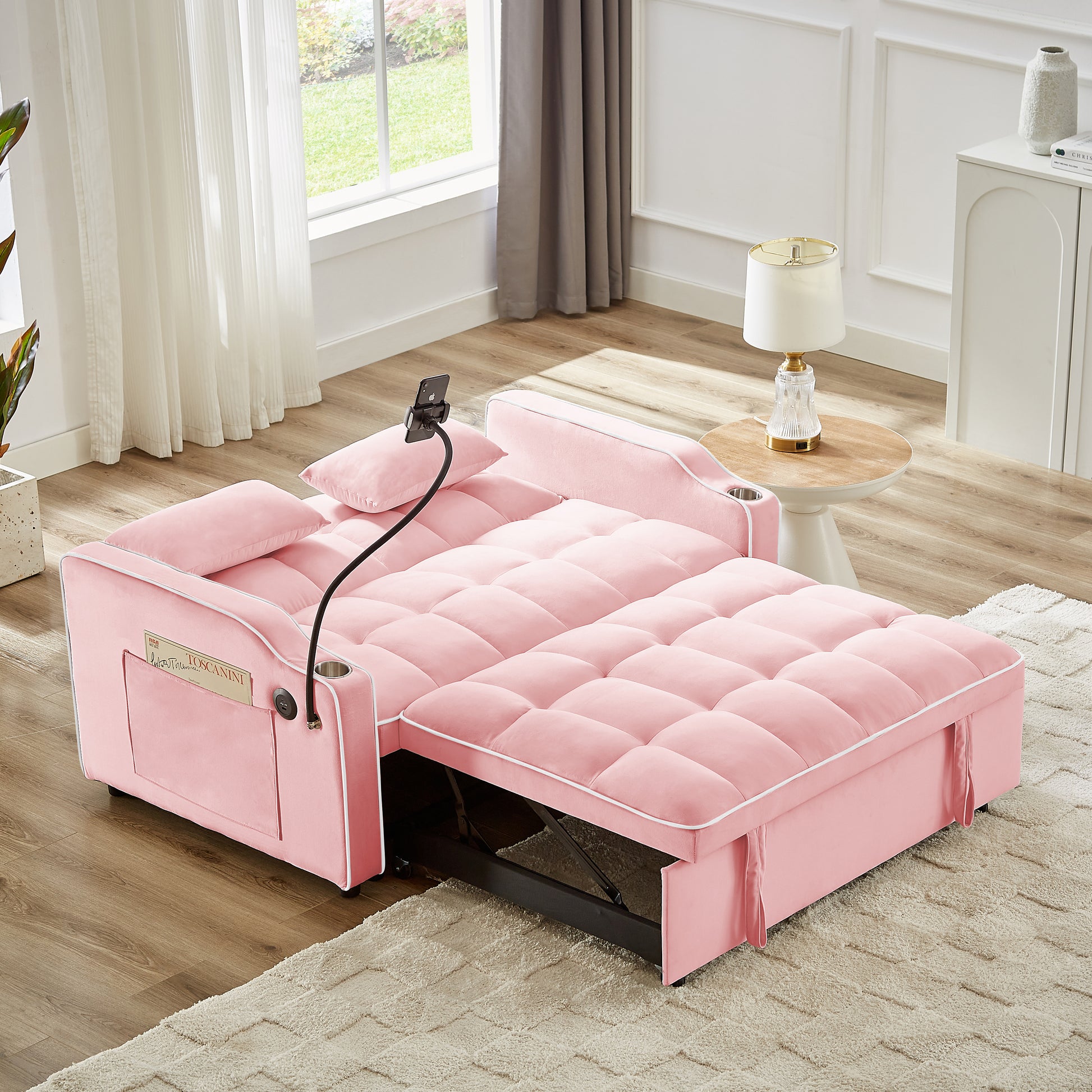 Pink velvet sofa bed with tufted cushions ideal for compact living spaces
