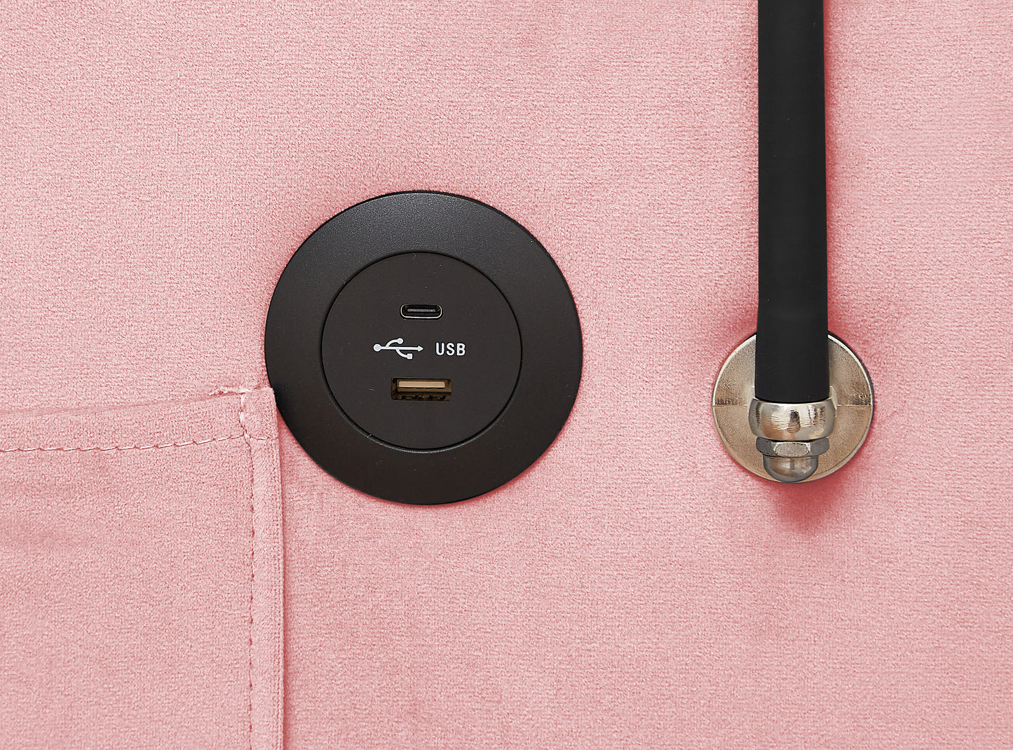 Embedded black USB charging port with USBA and USBC on pink textured fabric
