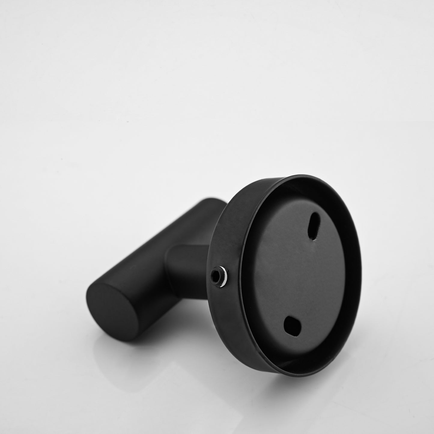 Black metal toilet paper holder with a modern minimalist design ideal for bathrooms