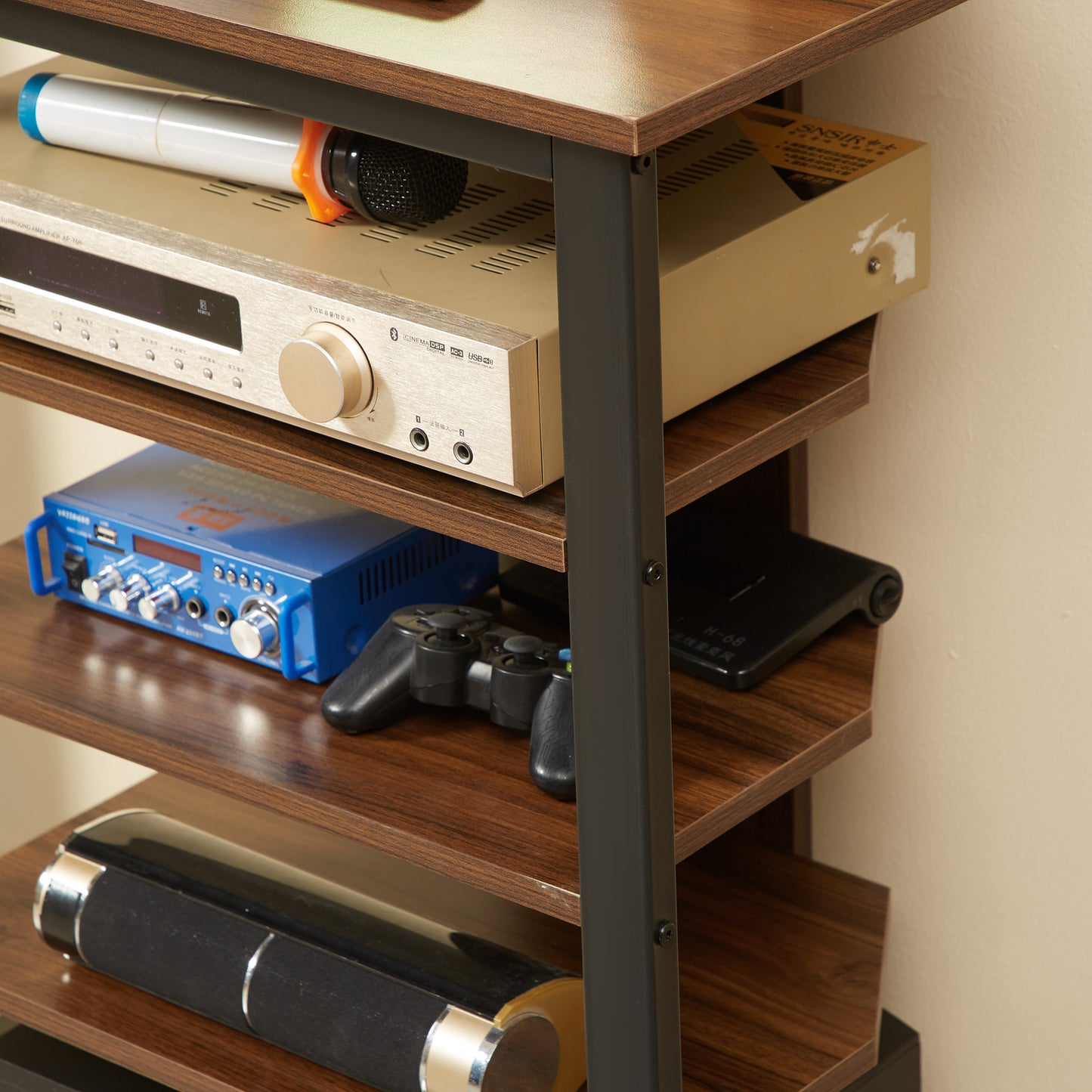Gold surround amplifier AP with a microphone resting on top