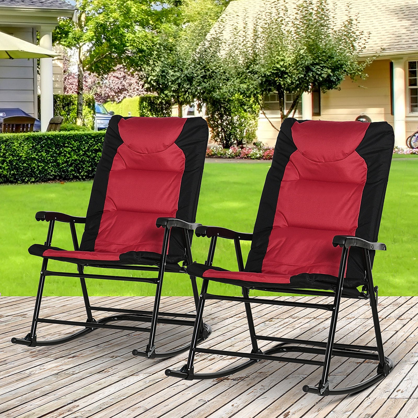 Two red and black upholstered rocking chairs with metal frames on a wooden deck