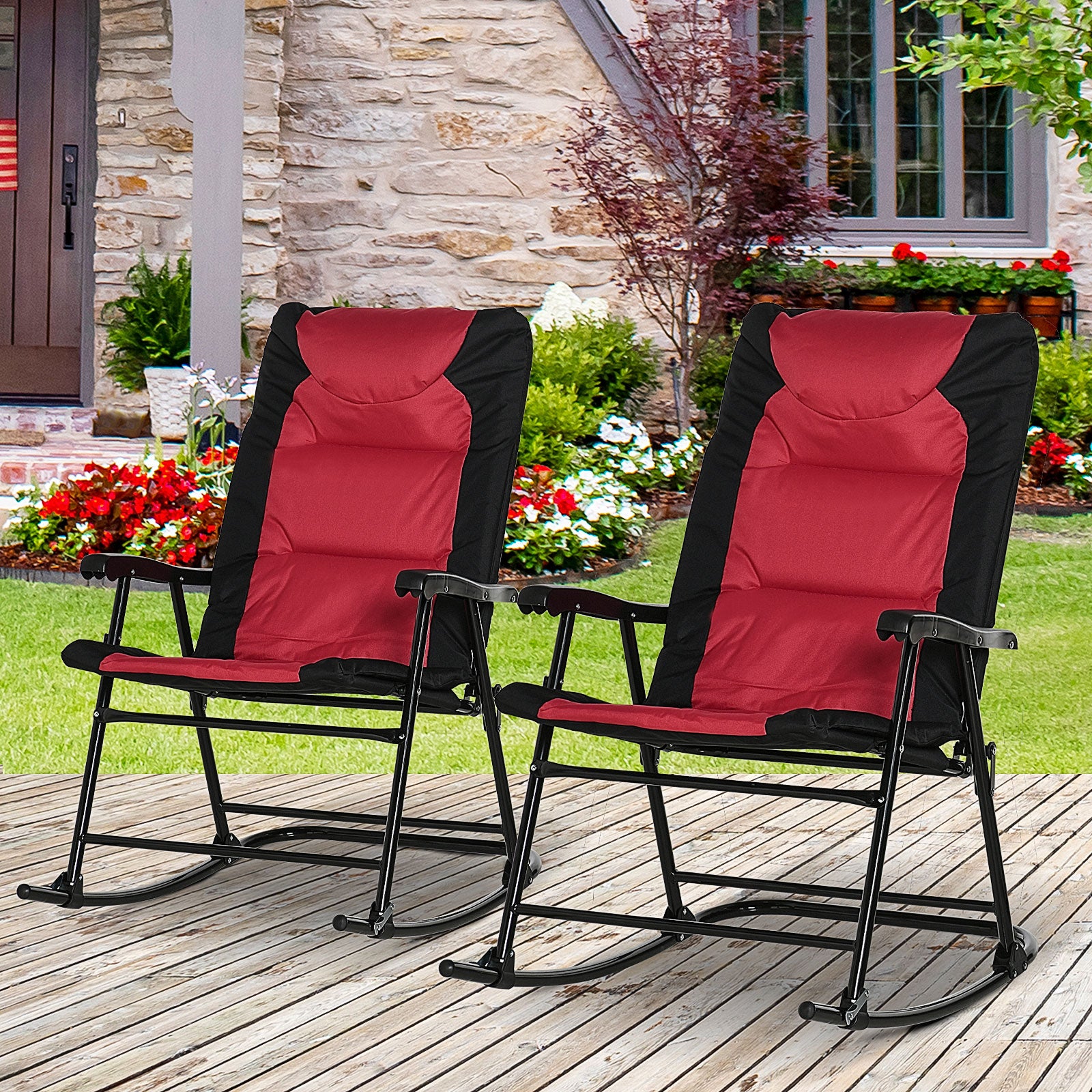 Two red and black padded outdoor rocking chairs with black metal frames on a wooden deck
