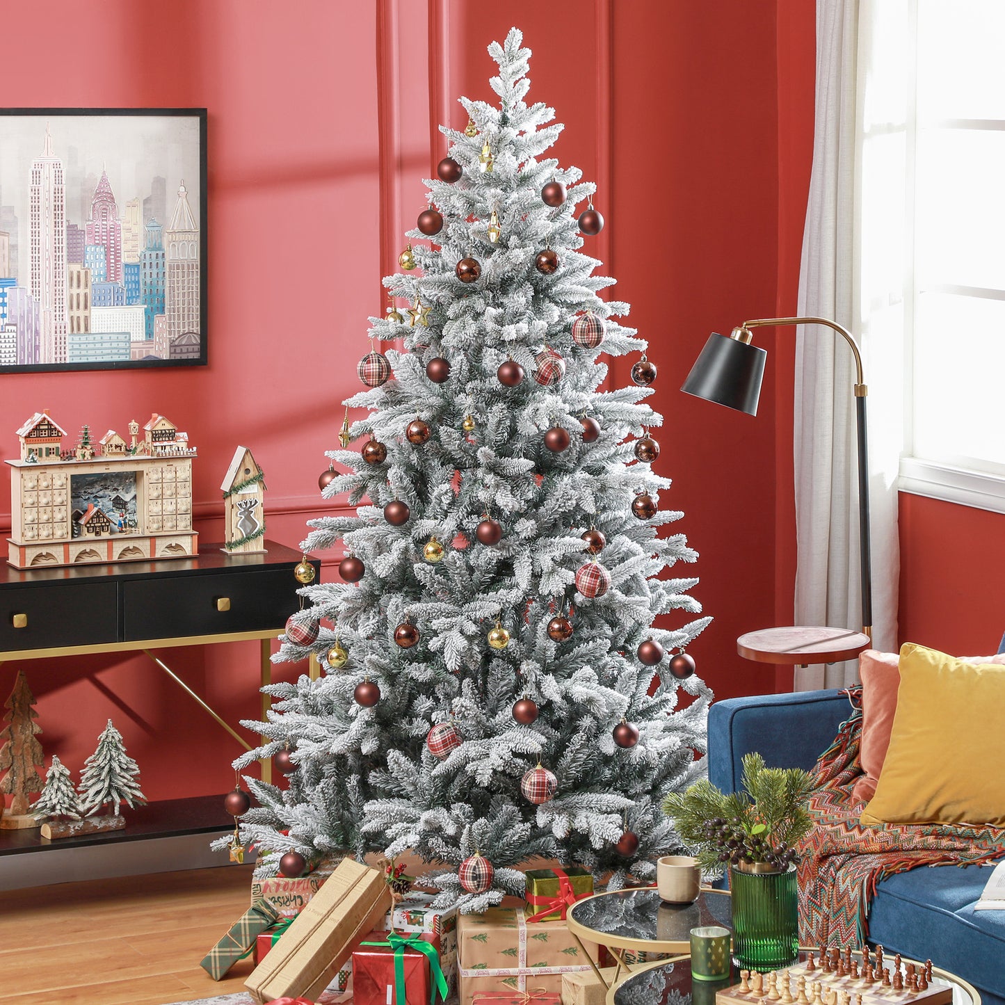 Flocked artificial Christmas tree adorned with plaid and dark red ornaments creating a festive centerpiece