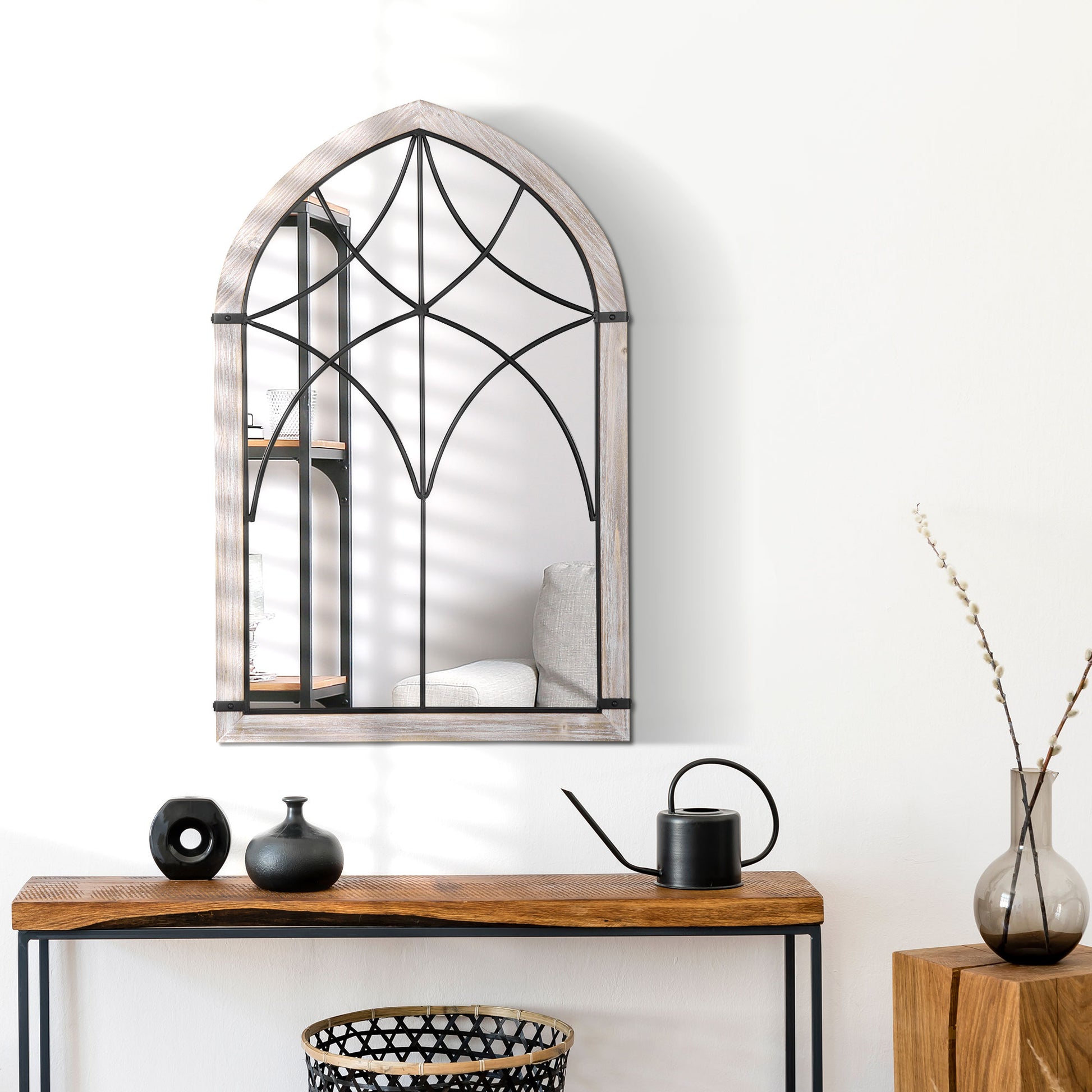 Arched window mirror with distressed wood frame and black metal gothic tracery