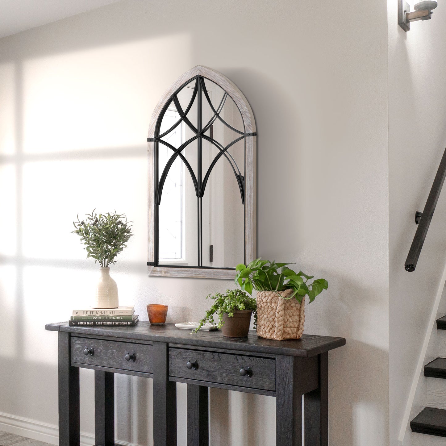 Arch window pane mirror with distressed wood frame and black metal accents