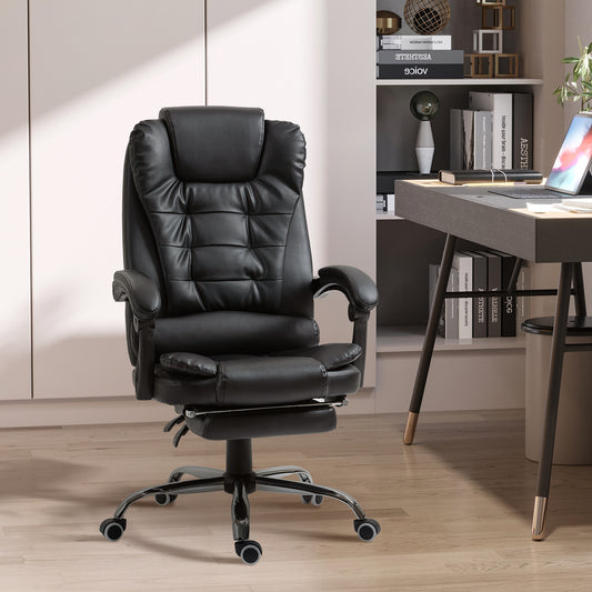 Black leather executive office chair with padded headrest and retractable footrest