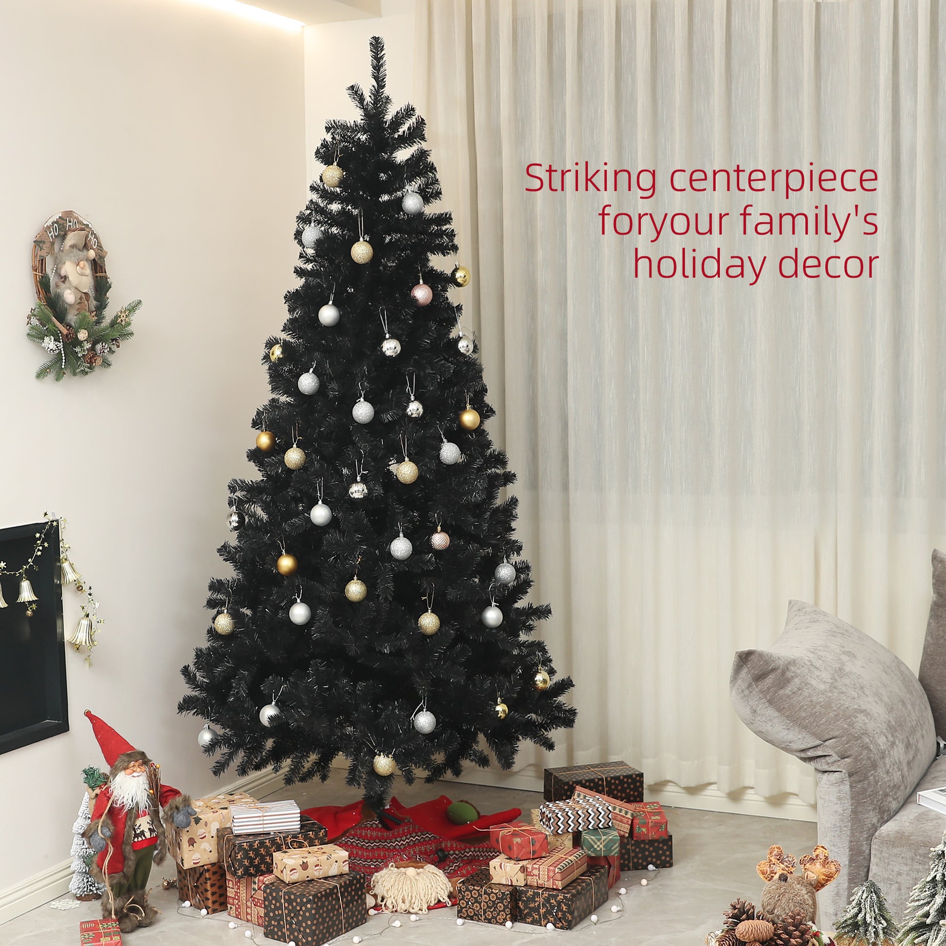 Black artificial Christmas tree with gold and silver ornaments