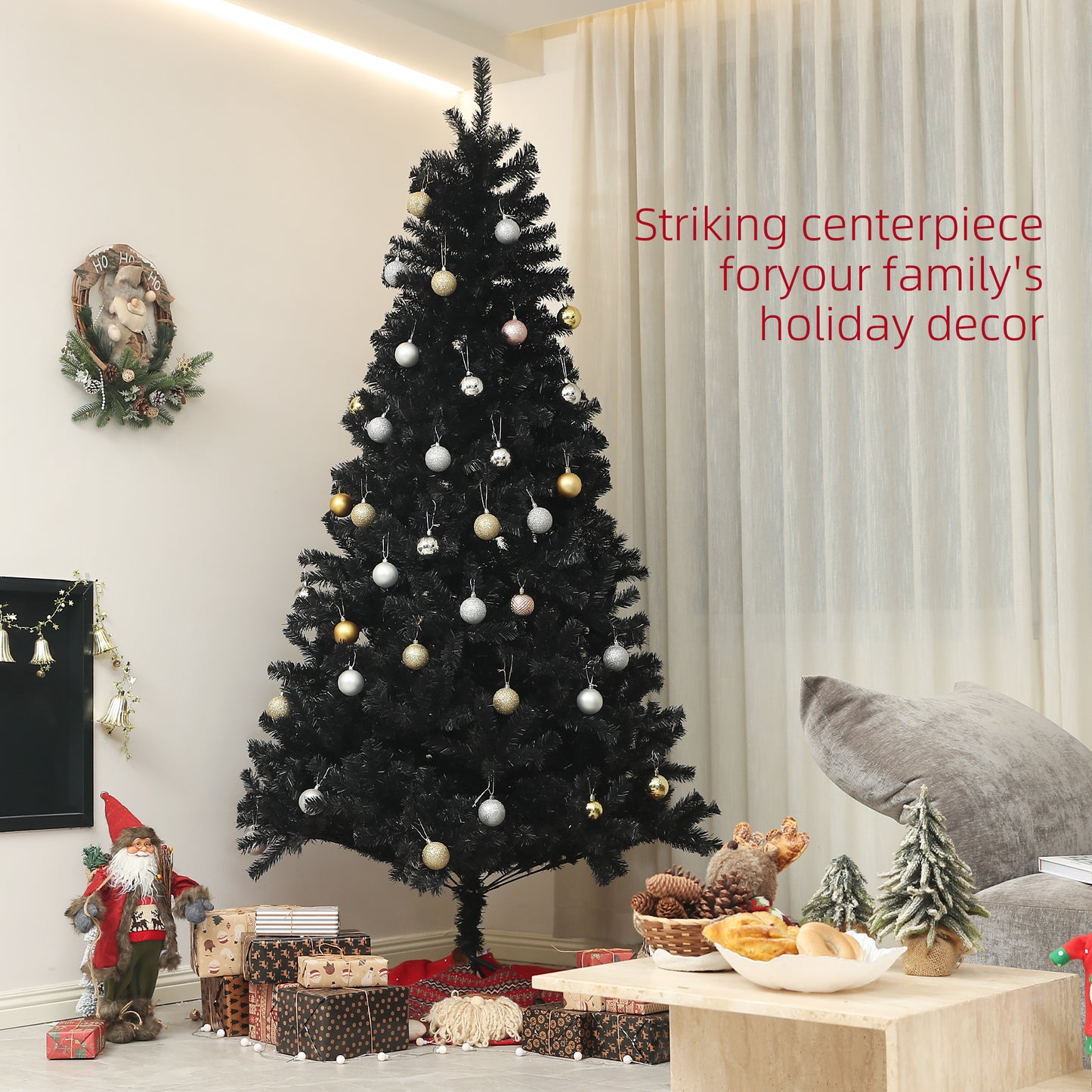 Black artificial Christmas tree with gold and silver ornaments
