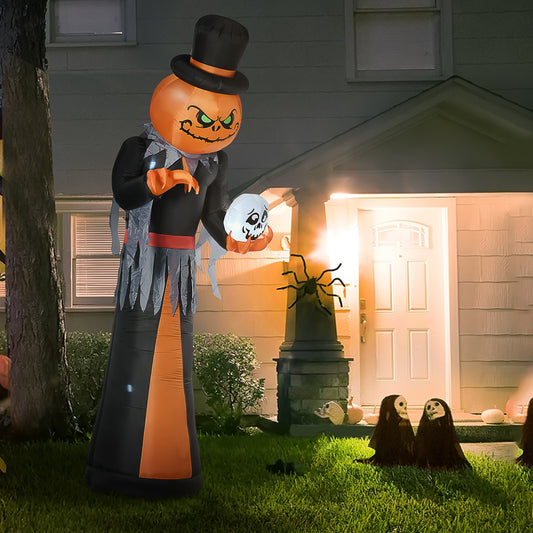 Giant inflatable Jackolantern figure in black suit holding a skull
