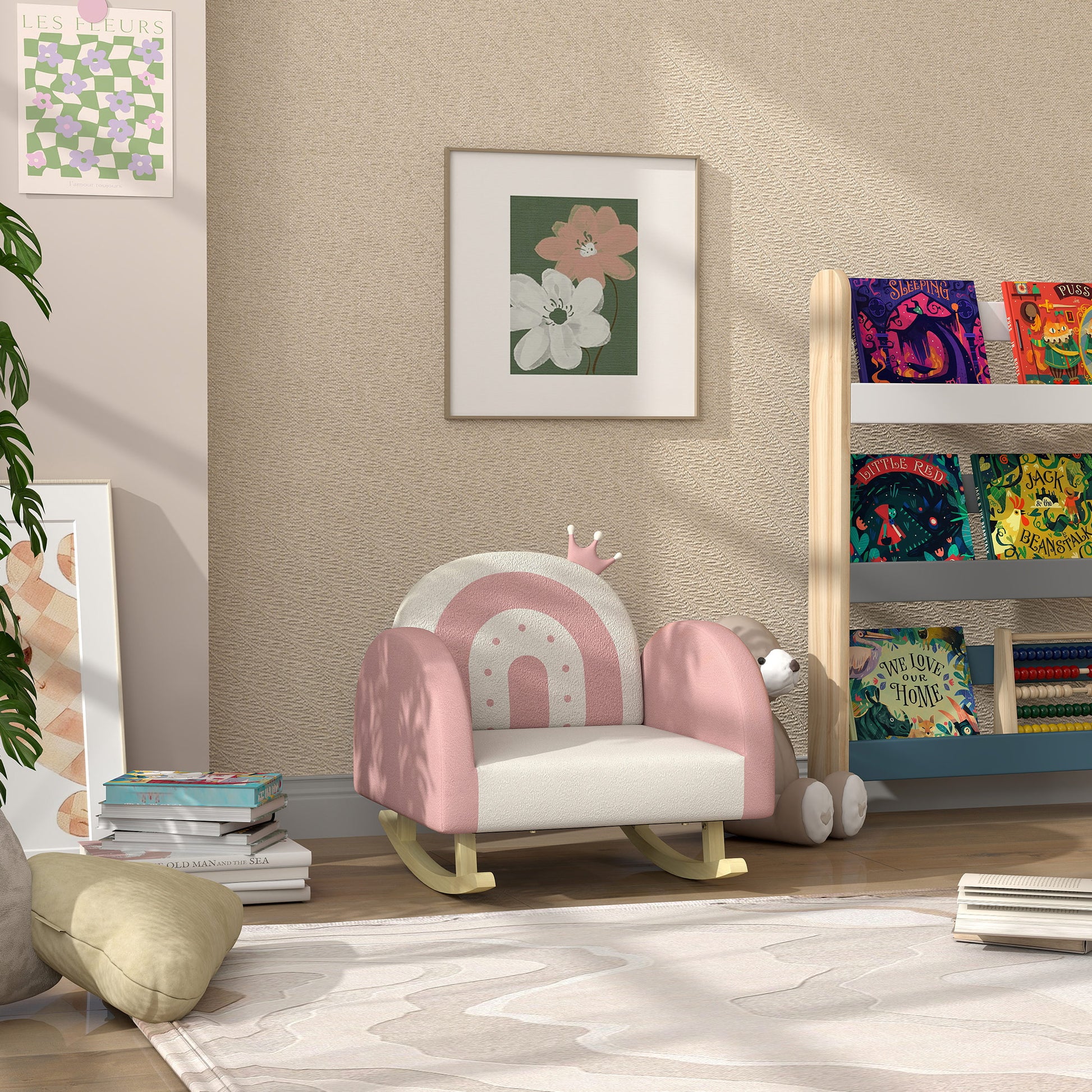 Pink and white rainbow toddler rocking chair with wooden base and plush bear friend nearby