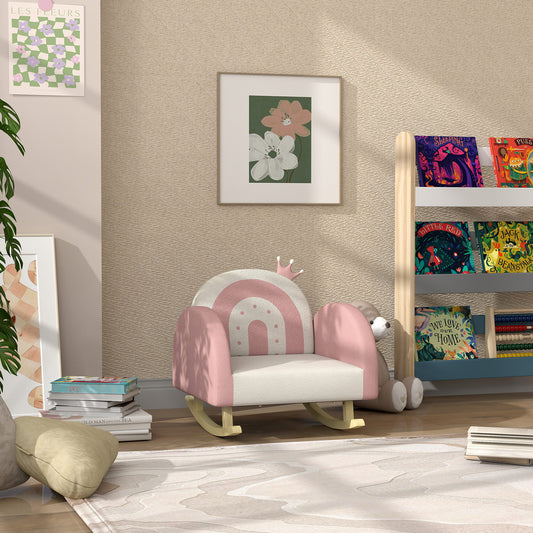 Pink and white rainbow toddler rocking chair with wooden base and plush bear friend nearby
