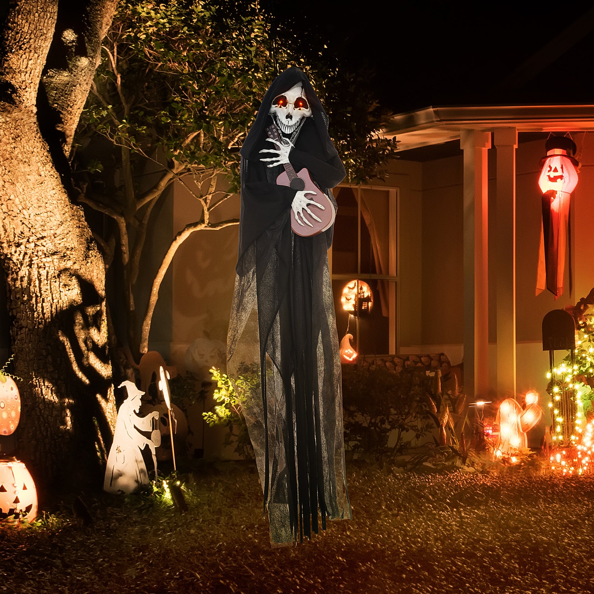 Scary hanging grim reaper prop with red glowing eyes and a guitar