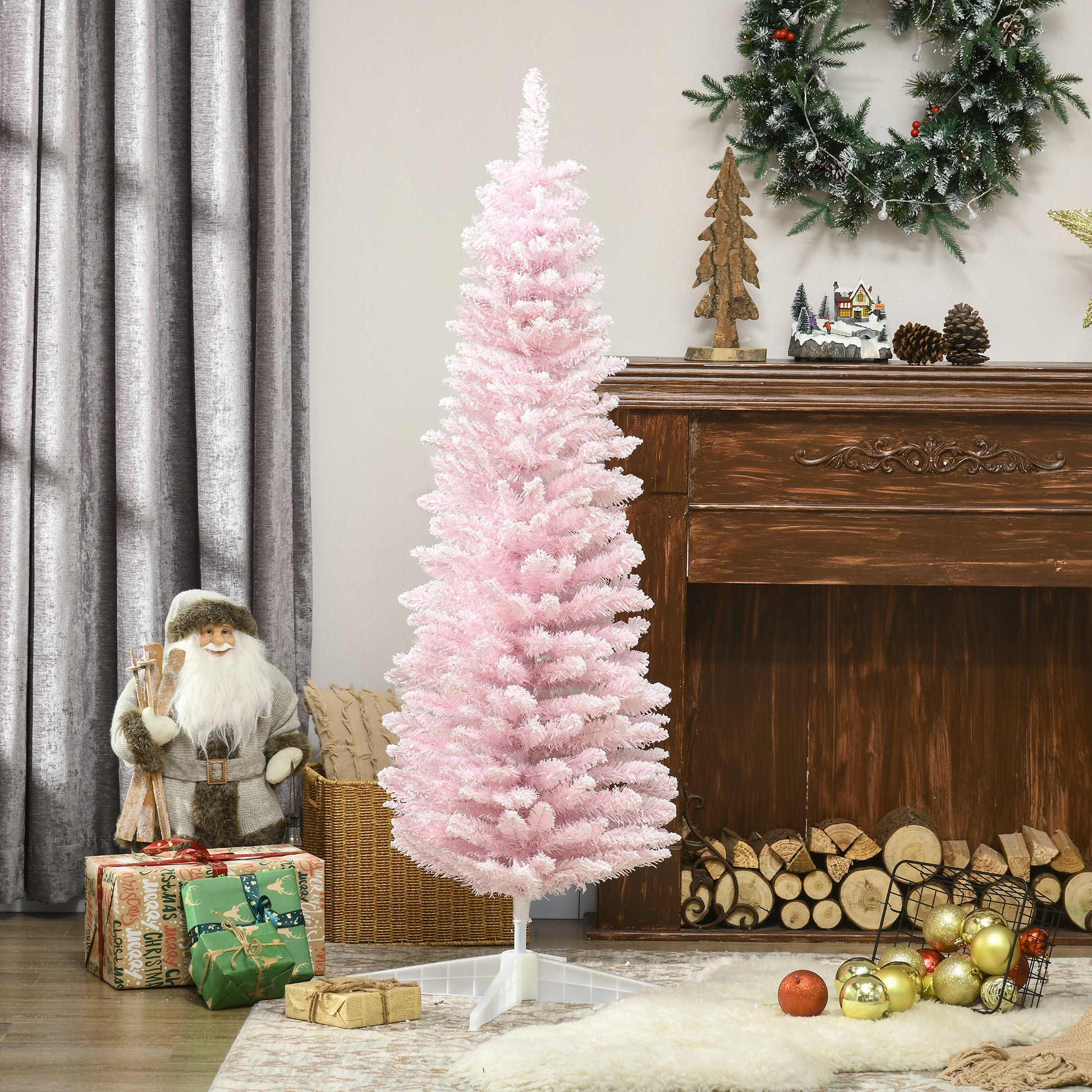 Tall pink artificial Christmas tree with flocked branches and white tips set up for holiday decorating