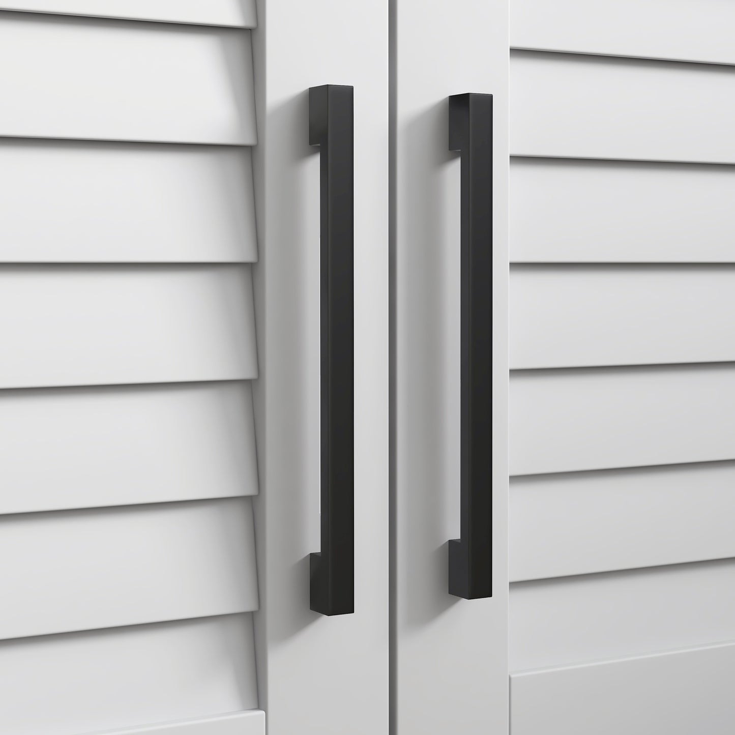 Two modern black cabinet pulls on a white louvered door panel