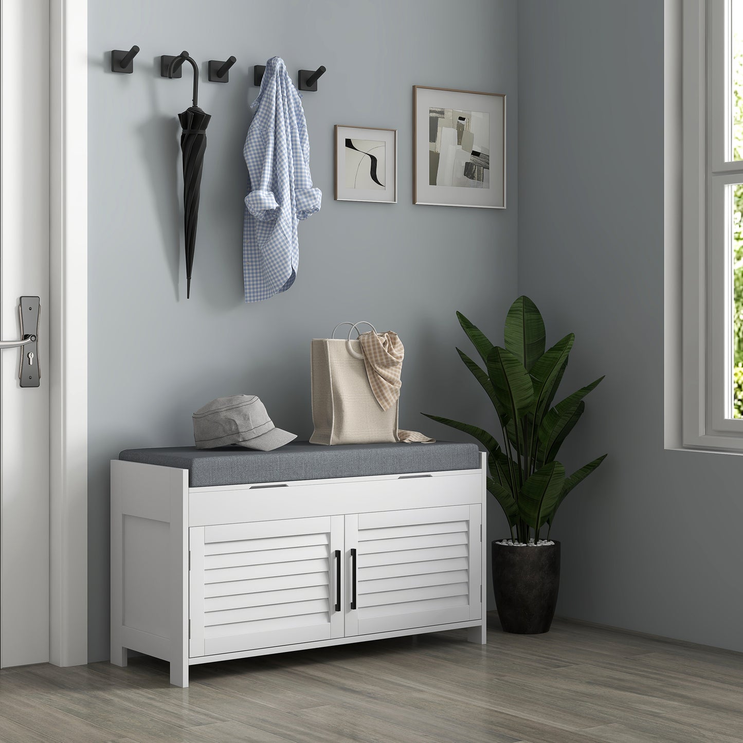 White storage bench with louvered doors and grey cushion perfect for entryway organization