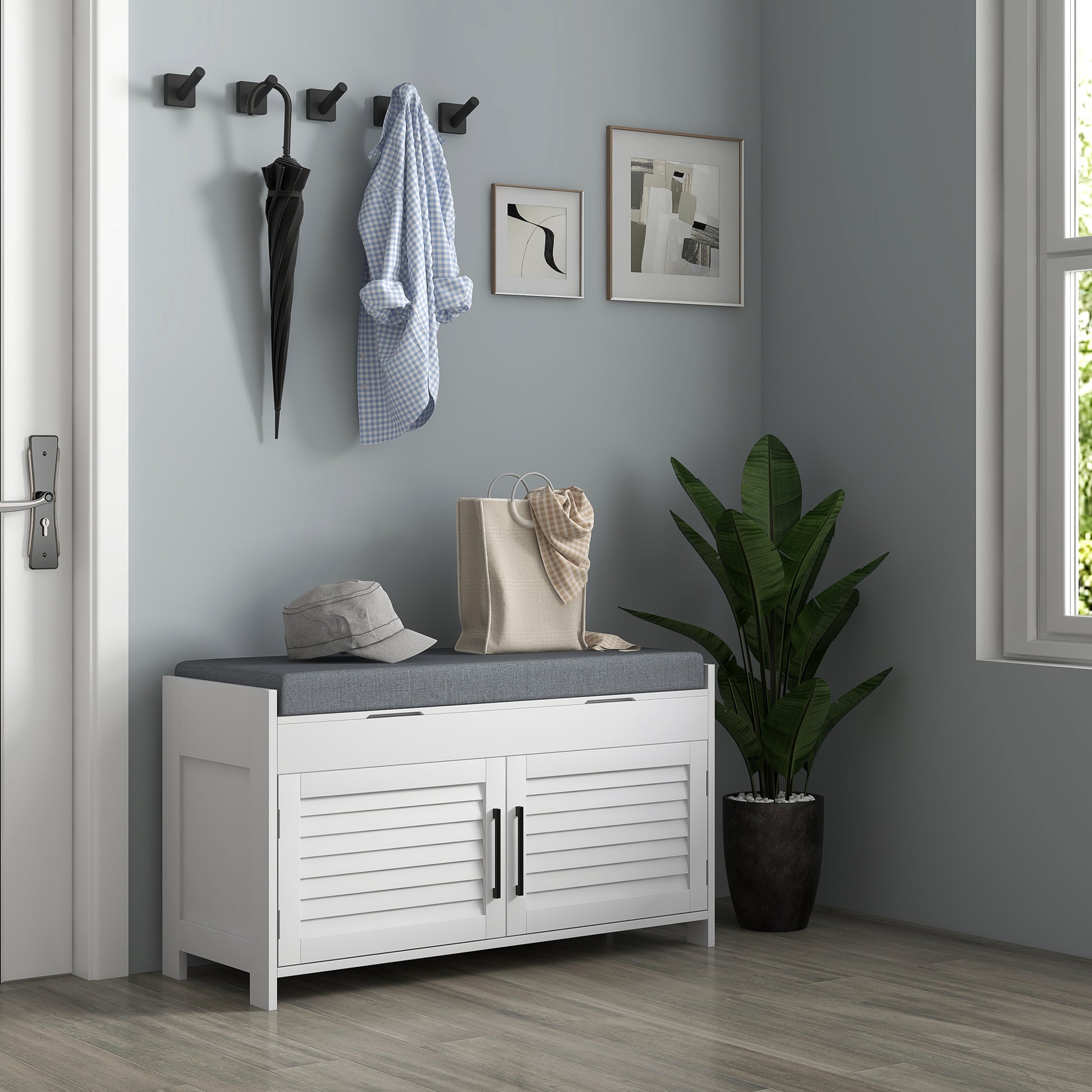 White storage bench with louvered doors and grey cushion perfect for entryway organization