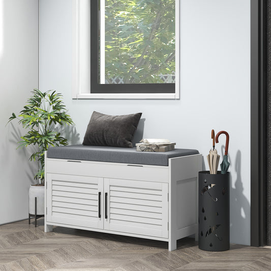 White entryway bench with gray cushion and louvered doors for shoe storage