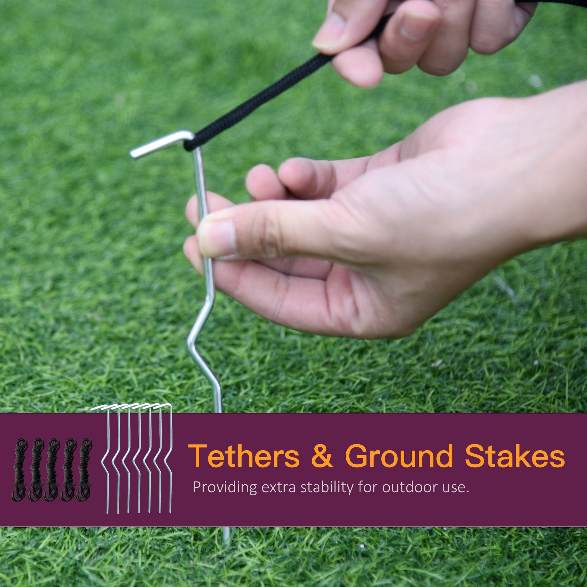 Silver metal ground stakes with black rope tethers securing camping gear outdoors