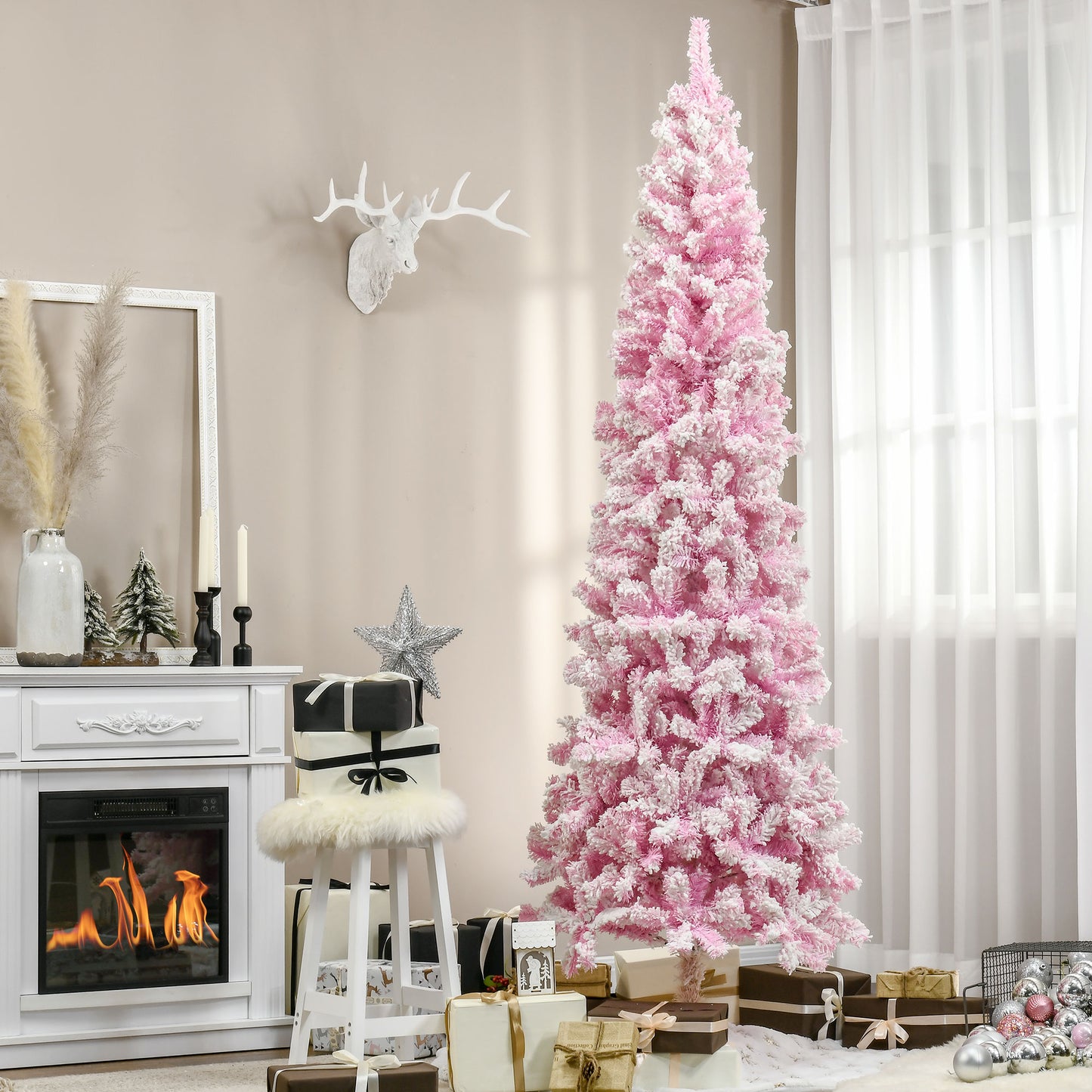 Flocked pink Christmas tree with white tips ideal for festive decor