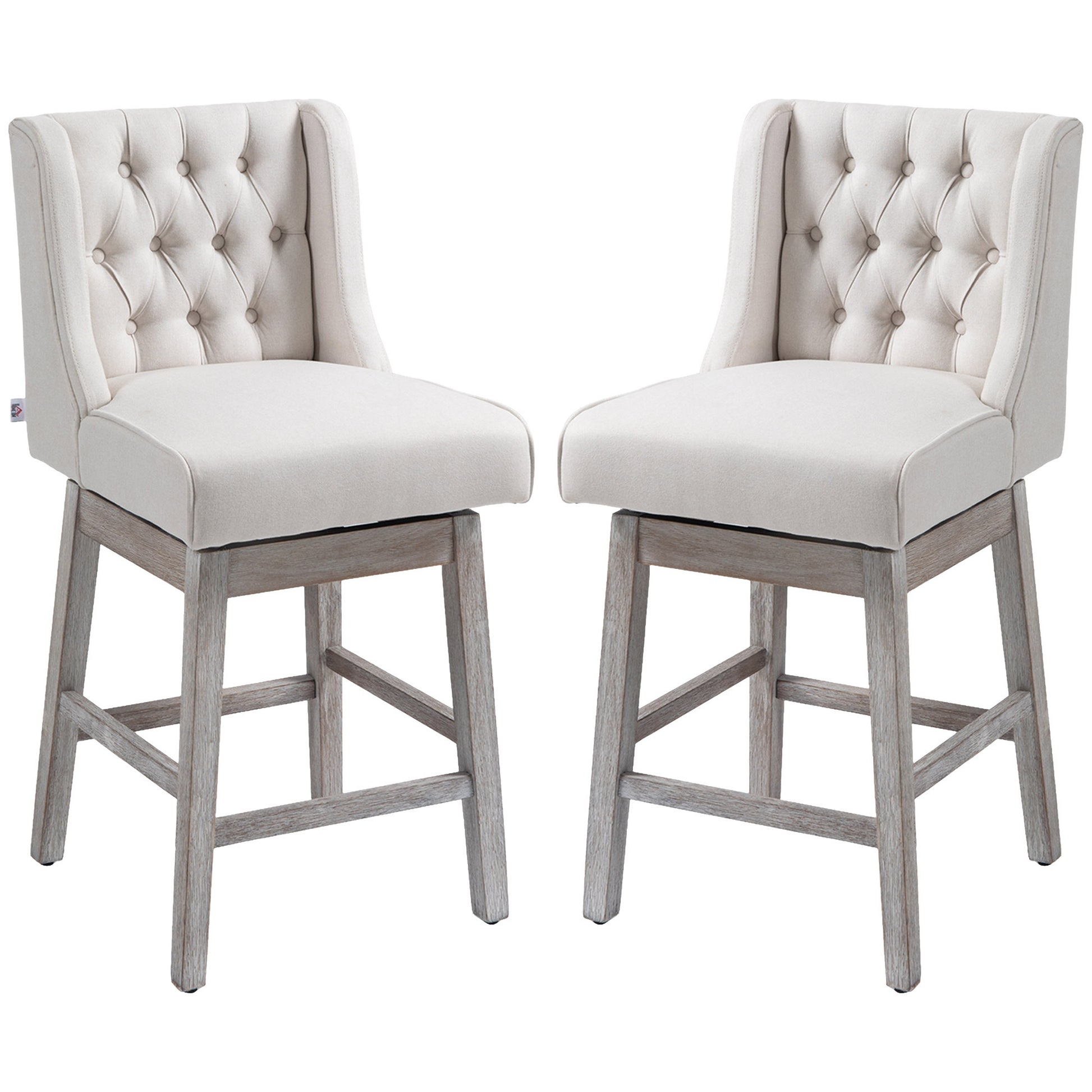 Pair of elegant cream linen tufted swivel bar stools with distressed wood legs