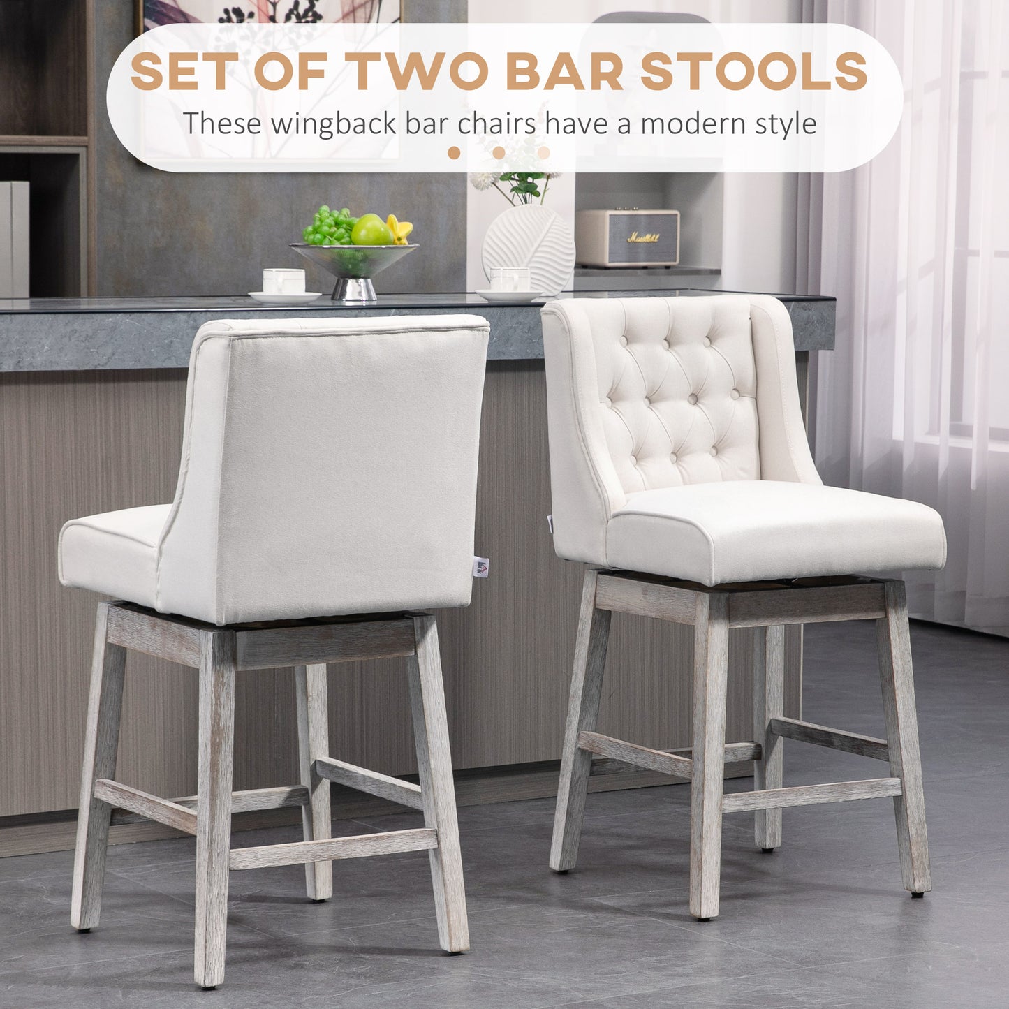 Set of two beige upholstered wingback bar stools with distressed wood legs and button tufting