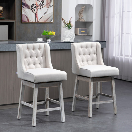 Two tufted cream upholstered bar stools with weathered wood bases and swivel seats