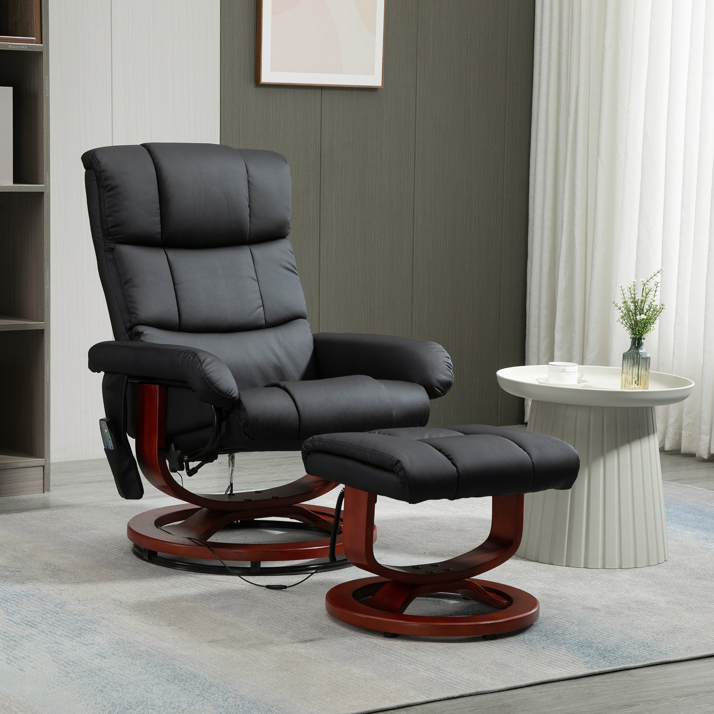 Plush black leather massage recliner with matching ottoman featuring a wooden swivel base for ultimate relaxation